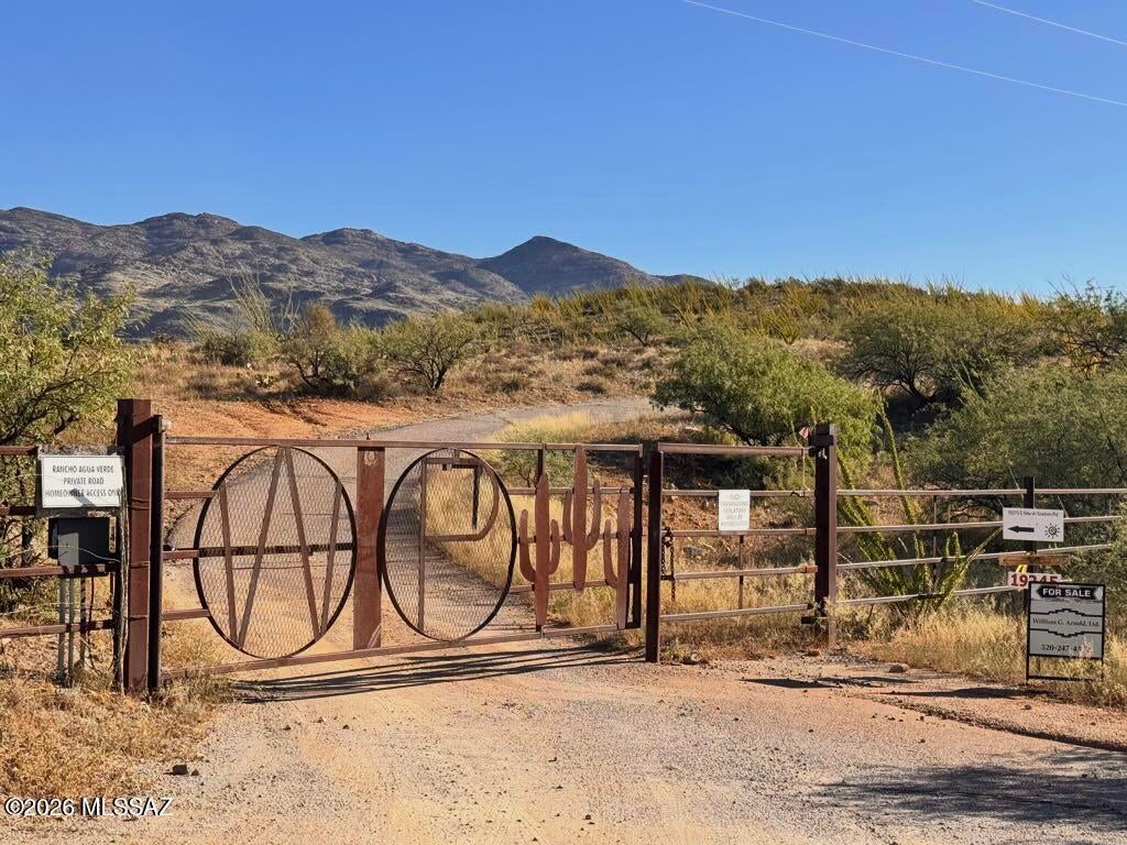 Private rural paradise with unblocked views of the southern flank of the Rincon mountains and Agua Verde Creek valley. Rolling foothills to the south and a green riparian belt along the northern boundary (which is Pima County open space). Gated community with very low density assuring your privacy. One home per lot. A guest home is permissible. Outstanding value, terrific wildlife, and jet-black nighttime skies ... all within a short commute to Tucson. Tax Code Number is spoofed (parcel is included in a larger piece / hasn't been split off by the Assessor or assigned its own TC#). Many of the pictures included are not of Lot 7 (see description).