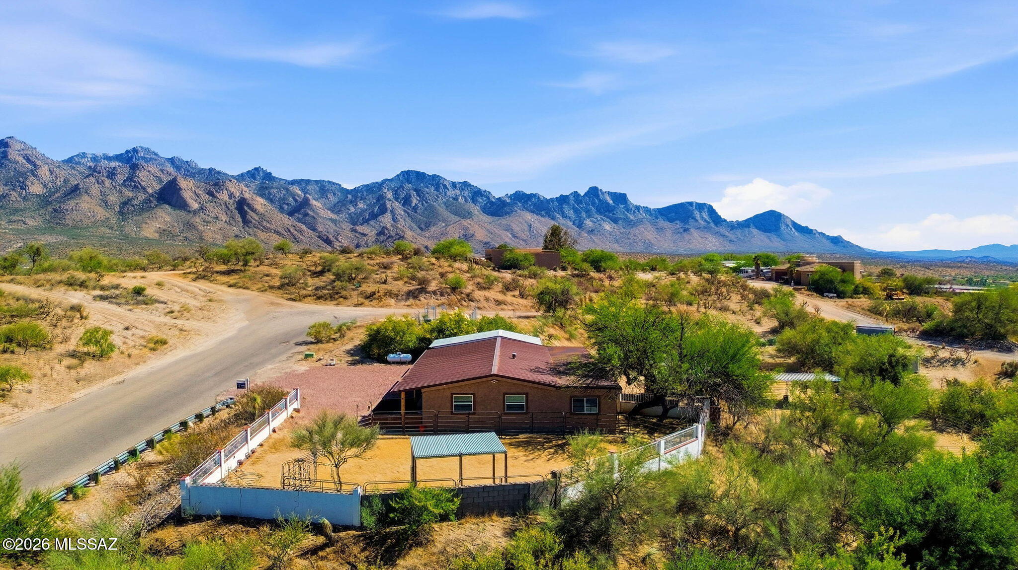 Range-Priced from $299,000 to $310,000.Updated 3-bedroom/2bth +Bonus Room with stunning mountain views, on over an acre of land! Porch faces the Santa Catalina Mountains & a detached garage inc cooling. Metal roofs & new windows. Inside, a semi-open layout connects the living & dining areas, with warm neutral tones, wood-look floors, & plenty of natural light throughout. The newer kitchen features stainless steel appliances and generous counter space.A versatile AZ room is perfect for year-round entertaining. Main bedroom includes a private bath and walk-in closet, while an indoor laundry room and pantry keep things practical. Backyard features a covered patio, a ramada, & horse corral. Side yard inc 2nd horse corral. Paved road up to the home which sits up high RV hookups are available - water, electric, sewer with plenty of space.
Loads of space for gardening, pets, & parking.
Outside your front door easy access to 50 year trailhead to Catalina State Park.  If you have horses you don't need to trail your horses to ride. Hike, bicycle, or horseback ride for miles and miles just from your front yard! 

Move-in-ready! A real paradise at a fraction fo the cost!  This deal is waiting for you! Don't hesitate.