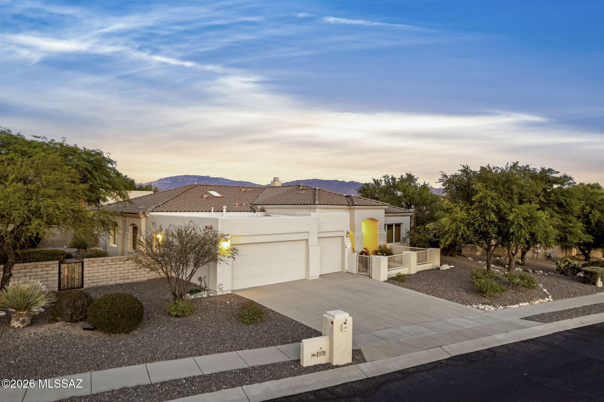 Live every day like you're on vacation in this welcoming 4 bed, 3.5 bath retreat on a premium corner lot within the gated Sabino Springs. Thoughtfully designed for comfort and ease, it borders Arizona National Golf Course and features a split floor plan that offers both privacy and quiet separation of space. The versatile 4th bedroom with its own full bath is perfect for visiting family, long-term guests, or a private hobby or study space. Step into the tranquil backyard to enjoy sweeping mountain views, brilliant sunrises and stargazing. An added bonus is there are no immediate neighbors to the north, east, or west to interrupt your views. At day's end, unwind on the patio with the natural gas fire pit or take a scenic weekend drive to cool Mt. Lemmon, less than an hour away.