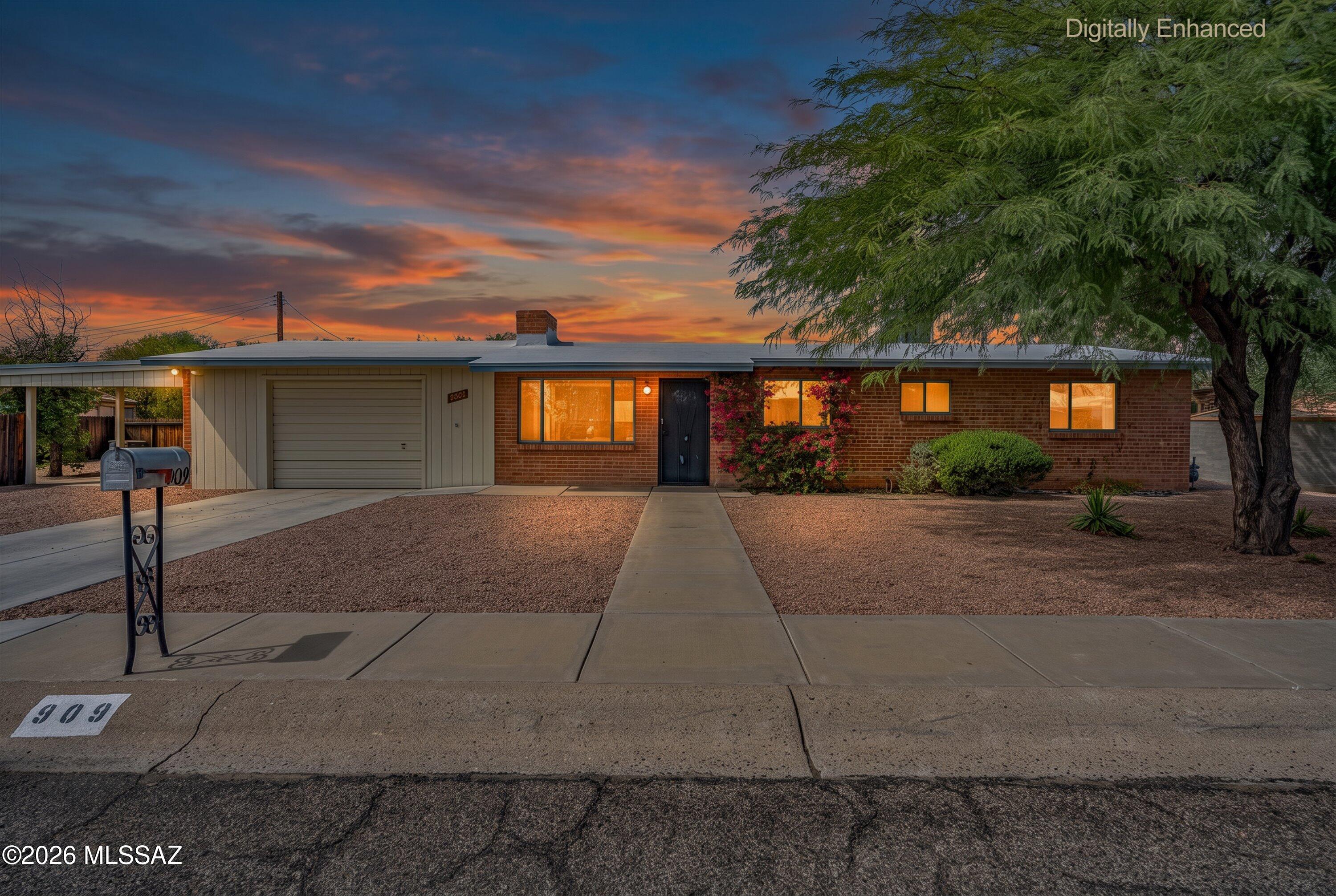 Classic Tucson charm meets comfortable everyday living in this spacious 4-bedroom, 2.5-bath brick home. Mature landscaping adds to the welcoming feel, while a wood-burning fireplace brings warmth and character inside. A thoughtfully designed 1982 addition expanded the home to include a family room, laundry room, primary bedroom and private bath, creating a flexible and functional floor plan. Enjoy an HVAC system just ~6 years young, a 1-car garage with workshop space, additional 1-car carport and garden shed. Out back, a freestanding ramada creates the perfect spot for relaxing or entertaining while enjoying Tucson's beautiful outdoor lifestyle. Conveniently located near shopping, dining, parks and everyday amenities.