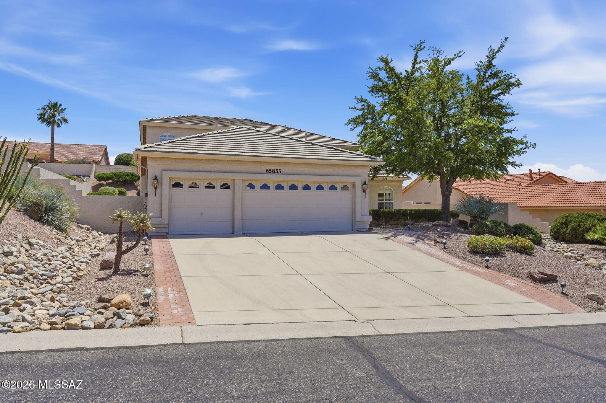 Welcome to this Gorgeous Galleria. This home features solid wood cabinets, granite counters and island with cooktop. Home has 2 bedrooms on the first floor and 2 bedrooms on the second which can act as guest rooms. There is a full 3 car garage with garage cabinets and laundry sink. Fourth bedroom features a murphy craft table. Laundry room has extra cabinetry & sink, There is a fireplace in the family room. Full landscaping w/large waterfall feature. Master bedroom is large w/double walk-in closets & shower wi/separate tub along w/double vanity. There is a separate powder room. Kitchen has a walk-in pantry & mini bar too. Cabinetry for much storage. There is a living room & dining room as well as an den/office.    New interior paint, carpet & some new tile w/new granite.  Move in ready.