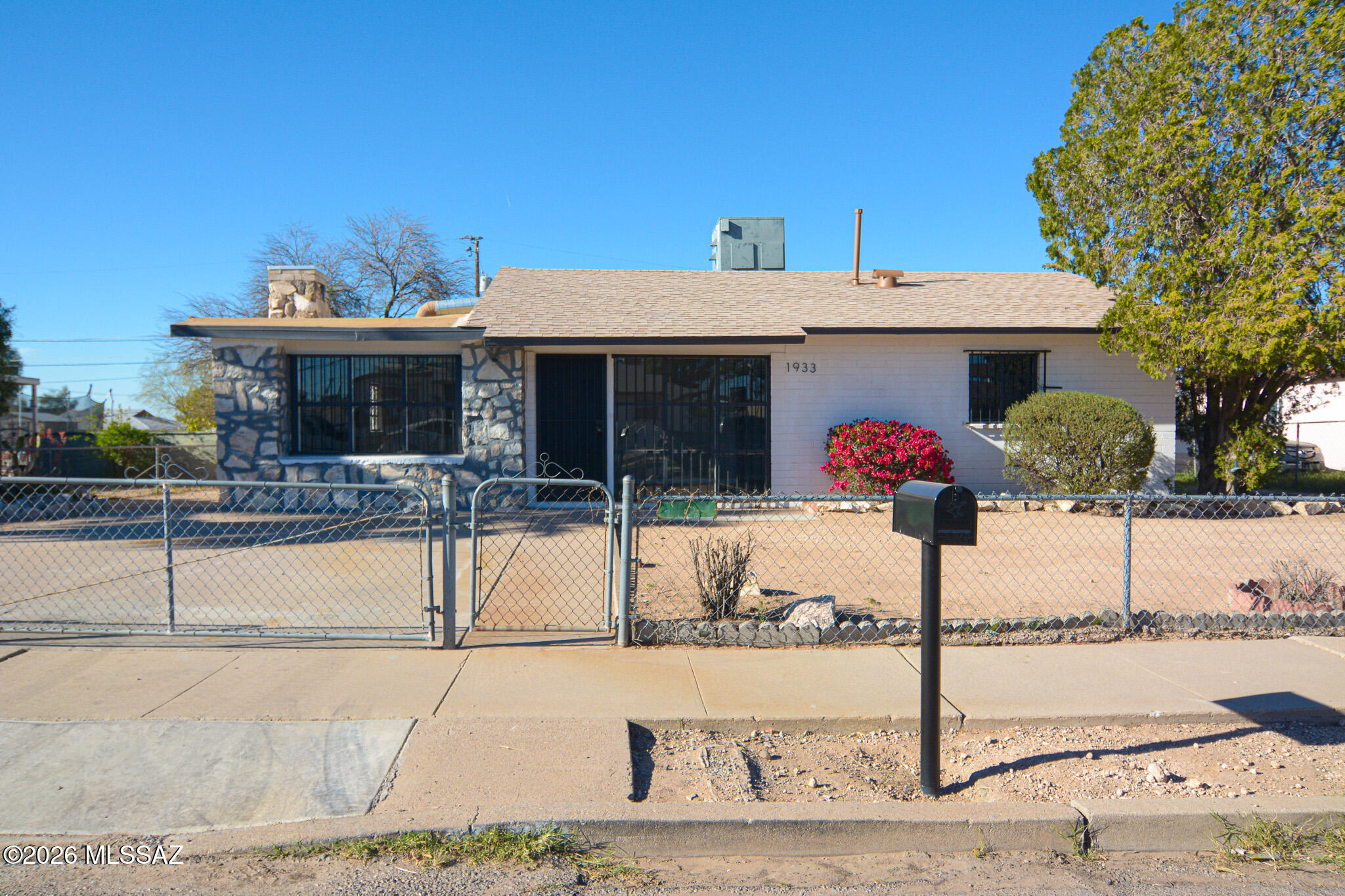 Beautifully remodeled Ranch style home. Located in a convenient South Central Tucson location. Charming block construction. Rich wood look LVP flooring. Updated kitchen with stainless steel appliances. New custom interior and exterior paint. Updated bathrooms. Large fenced yard. Mature trees. Upgraded door hardware and light fixtures. No HOA. This home shows beautifully.