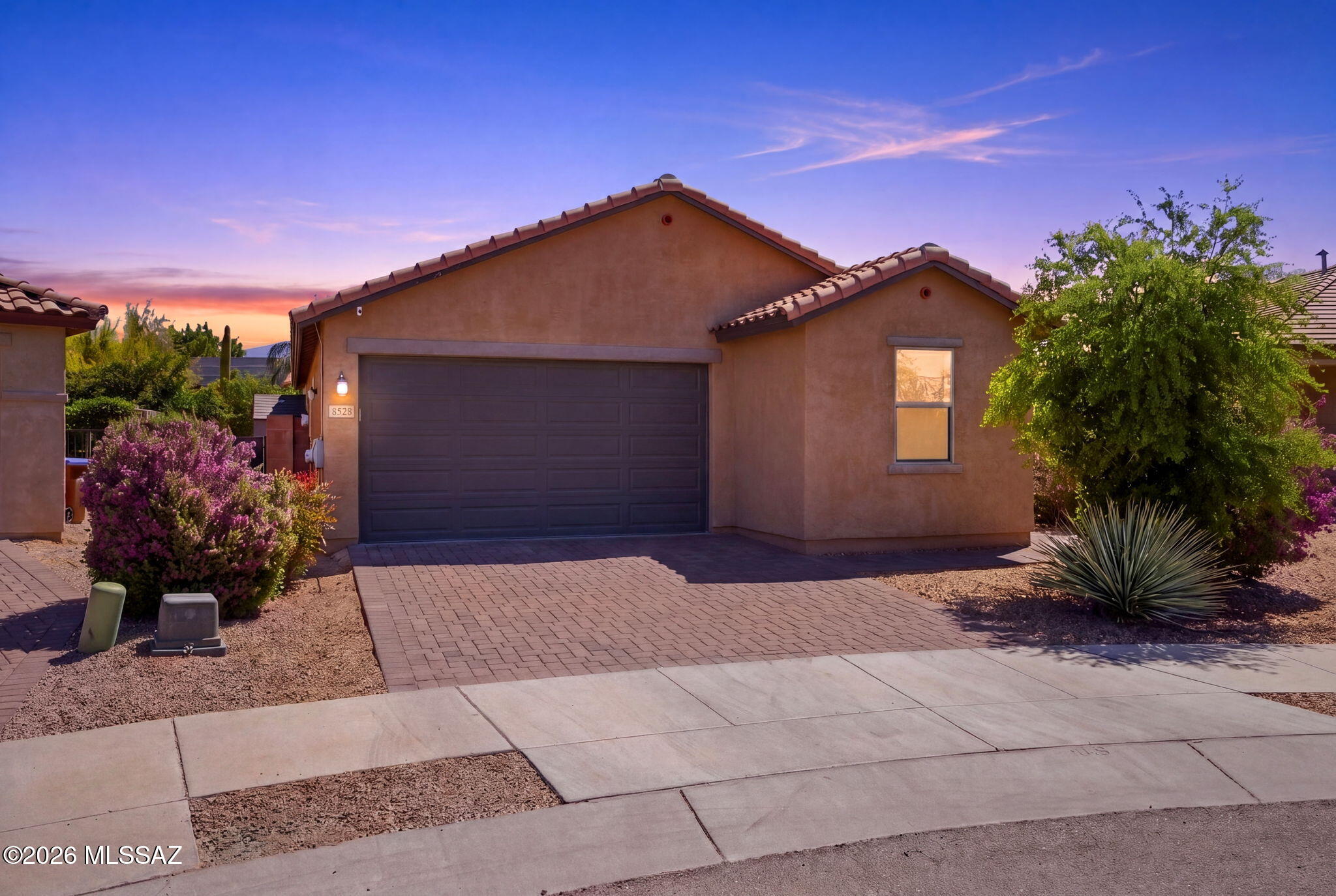 VA ASSUMABLE LOAN AT 2.25%*! Rare rate opportunity for HUGE SAVINGS! This 3 BED + DEN, 2 BATH Northwest Tucson home also features OWNED SOLAR for major energy savings (loan paid off at COE with acceptable offer). 1,861 sq ft of modern living with an open-concept layout, neutral tones, and contemporary finishes. Kitchen shines with granite counters, stainless appliances, and a spacious island. Primary suite offers a walk-in closet and dual-sink ensuite. Versatile den works as office, gym, or playroom. Oversized lot with spacious backyard backing to common area for space and privacy. 2-car garage, near shopping, dining, and major roadways. This home is ready for you! (*Buyer must qualify for loan assumption)