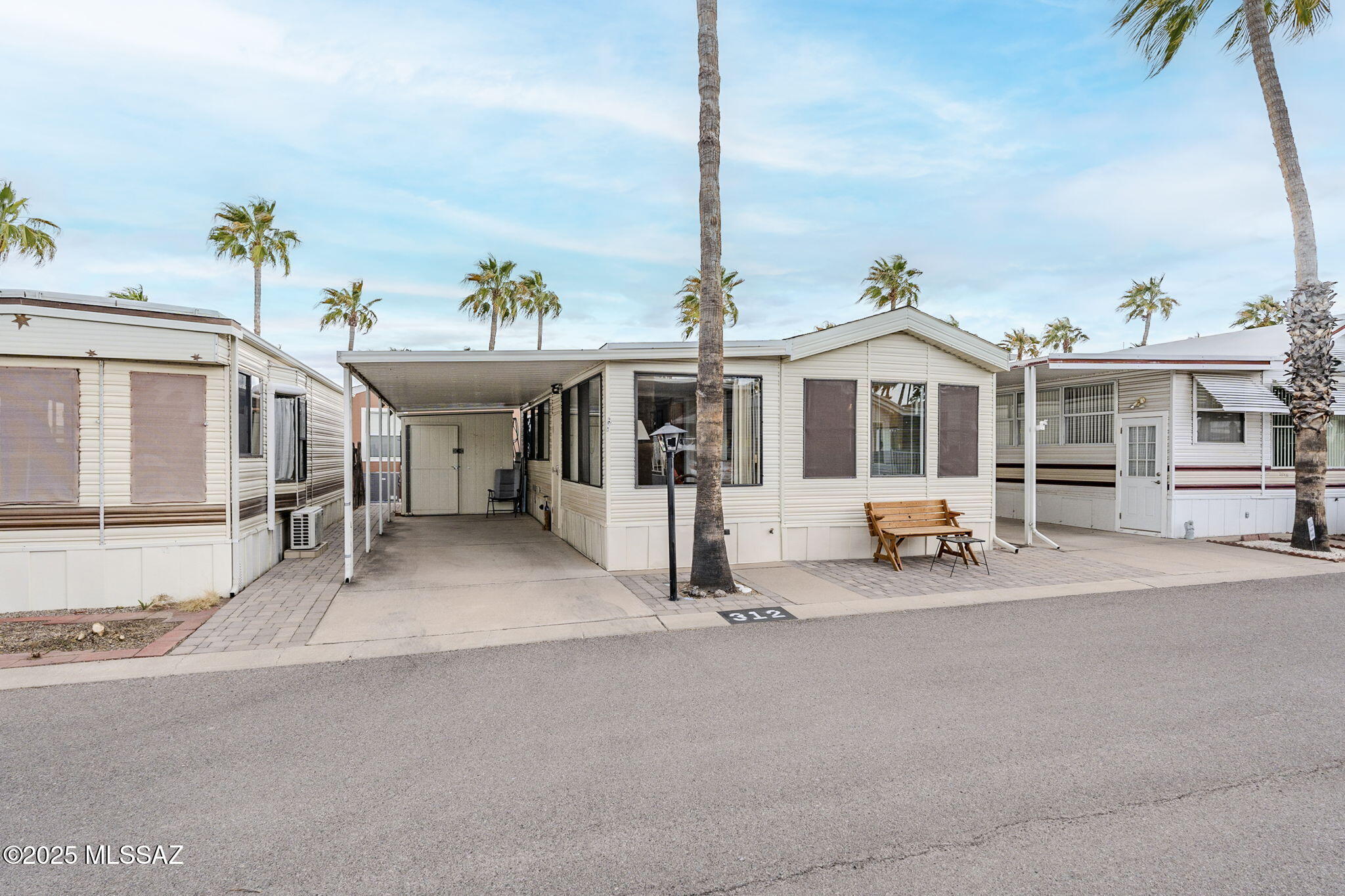 Ideal opportunity to own a spotless Park Model in the gated, active adult community of Rincon Valley West! Step into this beautifully furnished 2 bedroom, 1.5 bath home that radiates warmth and charm, with an abundance of natural light flooding through every window. The spacious bonus room features a convenient Murphy Bed, offering flexible use as either a second bedroom or home office--perfect for your unique needs.

The home is surrounded by a lovely pavered patio, with two cozy spots to relax and enjoy your morning coffee or unwind in the desert evening breeze.

Includes a large shed for all your storage needs or hobbies. This extra space offers endless possibilities, whether you're looking for a place to work on projects, store tools, or have additional space to make your own. The beautiful 55+ active adult community of Rincon Country West offers five-star ameneties and activities including pickleball, tennis, dancing classes, arts and crafts, sewing, woodworking, pottery, shuffleboard and bocce ball courts, a well-equipped exercise room, heated pools and hot tubs, and social events. You can be as busy or relaxed as you care to be! Close to shopping, dining, entertainment, hiking and biking trails! Live the retirement life you've been dreaming of in the beautiful southwest desert! Annual recreation fee of $8500 includes park ameneties, water, sewer, and garbage. No additional lot rent.