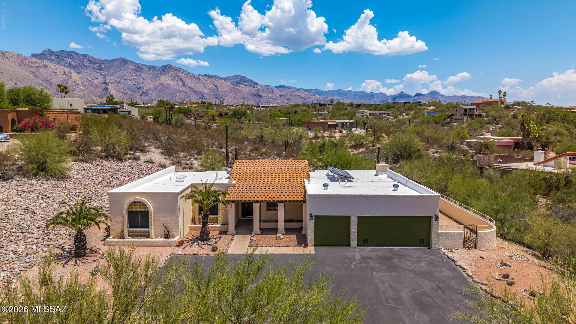 With a nod to Mediterranean styling, a southwest retreat nestled in desirable Heatherwood Hills community. This residence perfectly blends classic desert charm with modern functionality, offering an impressive amount of light-filled living space. Exposed beam kitchen and featuring 4 spacious bedrooms, the thoughtfully designed floor plan provides plenty of room for both daily relaxation and effortless entertaining. Situated on a massive, private almost 1 acre lot, the property boasts incredible mountain views and a serene backyard backdrop that feels miles away from everything, while remaining just a short drive from local dining and shopping. Complete with a 3 car attached garage and a beautiful stucco exterior, this Catalina Foothills area gem captures the very best of AZ living. Imagine enchanting evenings in the backyard, showcasing a covered patio, pavers, and abundant space for outdoor relaxation. Don't miss this incredible gem!