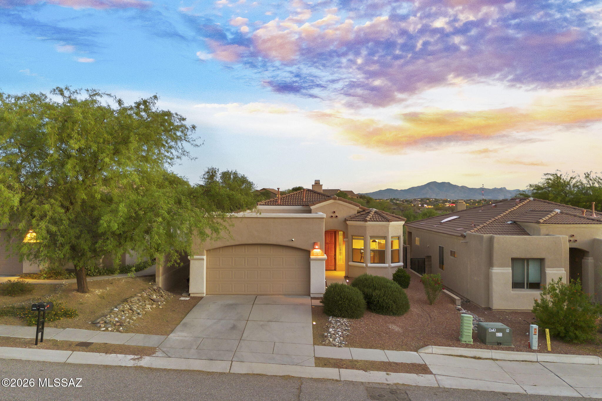 Beautifully appointed 3-bedroom, 2-bath home located in the highly desirable Rancho del Lago community, within the top-rated Vail School District. Thoughtfully upgraded throughout, this home features granite countertops, rich maple cabinetry, a charming bay window at the kitchen nook, custom entertainment center, and a cozy gas fireplace. The spacious primary suite offers a private slider leading to the patio, creating a seamless indoor-outdoor living experience. Additional highlights include an extended 2-car garage, 8-foot entry door, soft water loop, and a gas stub for a future BBQ--perfect for entertaining.
Enjoy breathtaking Rincon and Santa Rita Mountain views with ideal north/south exposure, filling the home with natural light. The open-concept floor plan provides both comfort and functionality, while the location offers easy access to I-10, shopping, and dining. Experience stunning desert sunrises and sunsets right from your own backyard--this is Arizona living at its finest. Welcome home!!