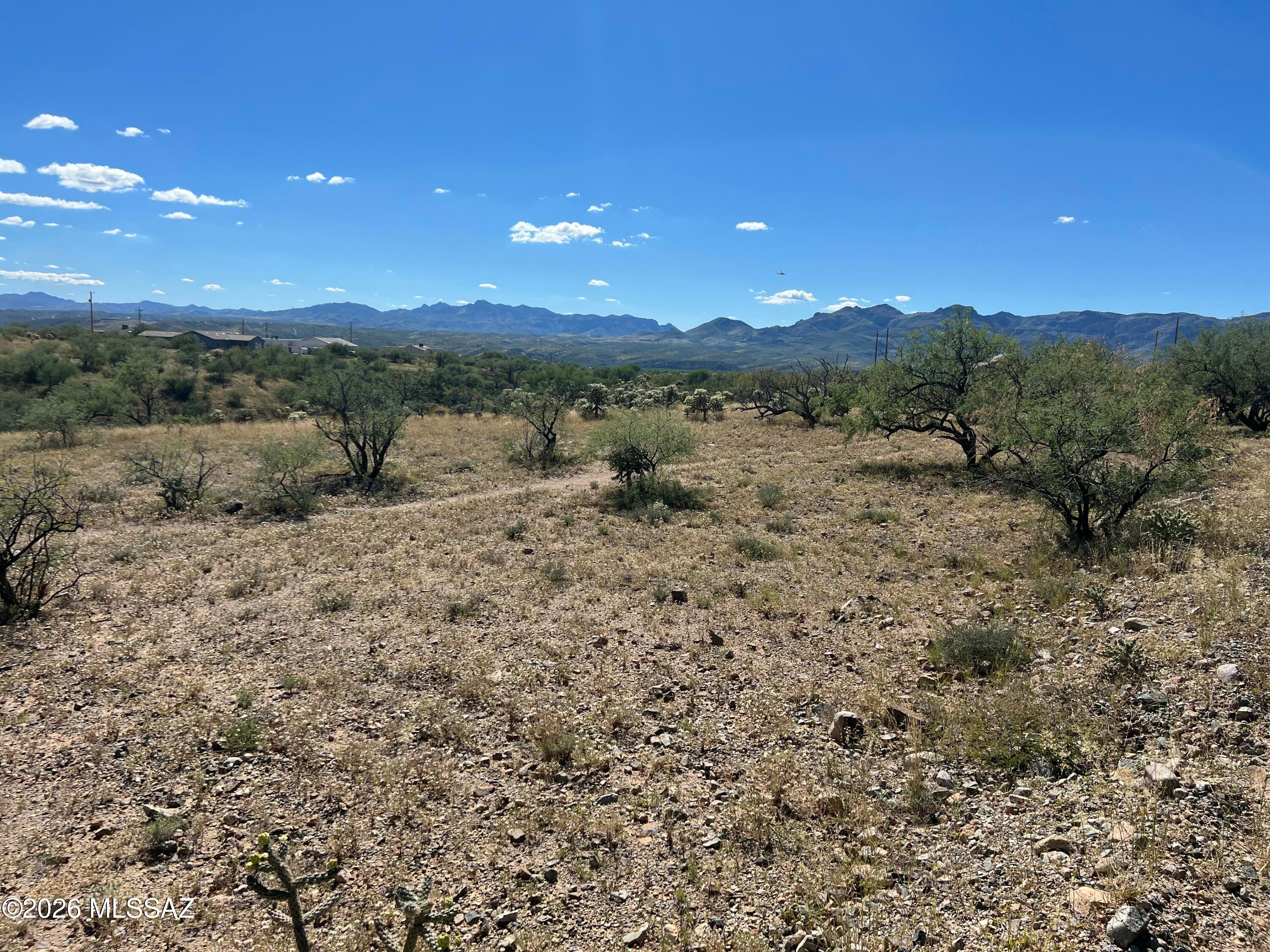 Room to dream in Rio Rico! This 1.02-acre lot in Rio Rico Ranchettes offers a spacious setting to explore your vision for a future home. Located just off Avenida Pastor on Concha Court, the property features surrounding views and convenient proximity to I-19 and a local market. Imagine a home designed around your lifestyle, with outdoor spaces for relaxing and enjoying Southern Arizona living. Come discover the possibilities! Buyer to verify utilities, zoning, and building requirements.