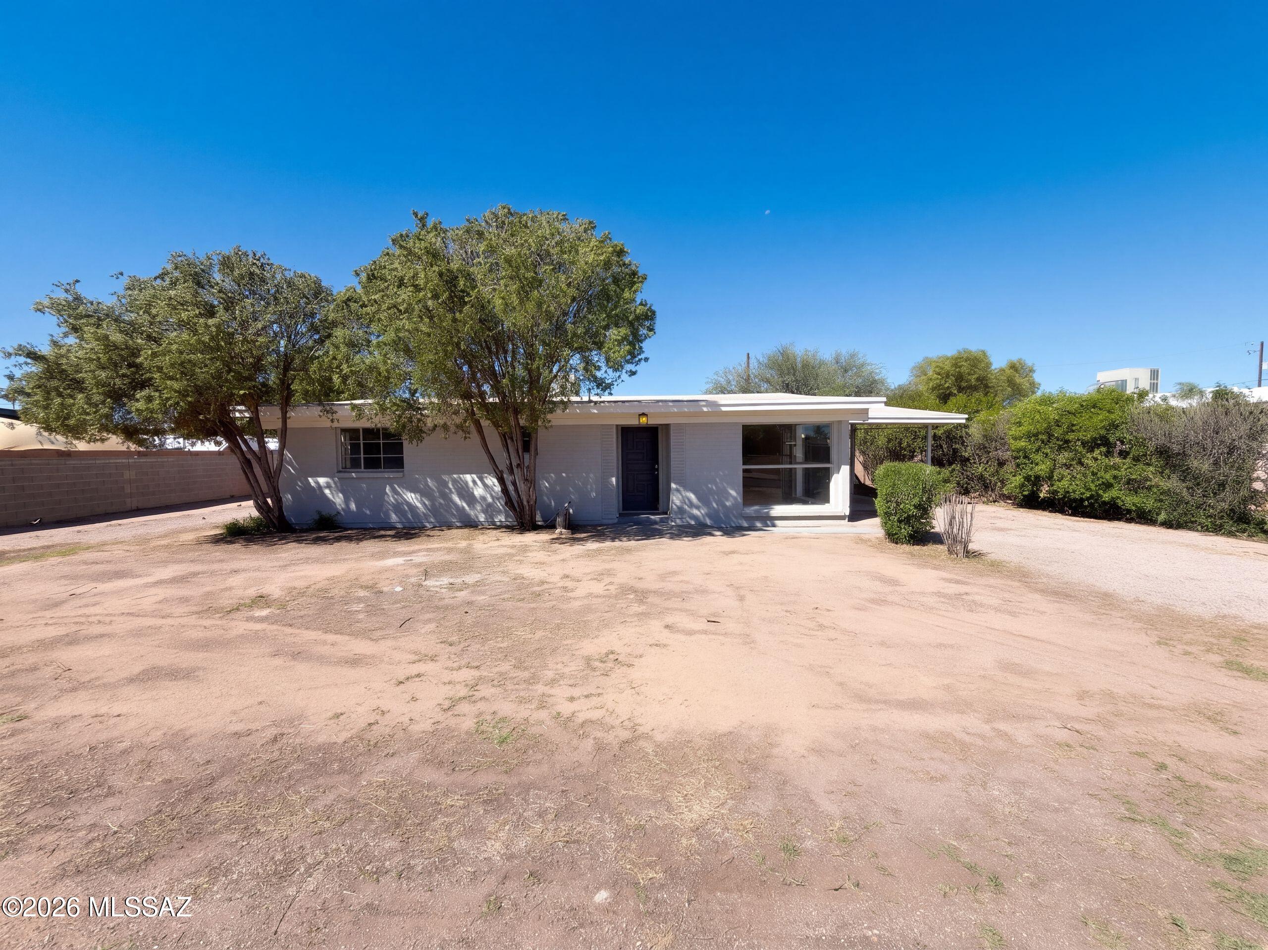INCREDIBLE BUYER INCENTIVES: $4,000 MORTGAGE CONCESSION. Seller will pay up to $4,000 at closing towards your interest rate buydown if you finance with lender of sellers choice.

2817 N Walnut Ave is a one-story Tucson home with 1,521 square feet of living area, three bedrooms and two bathrooms. The kitchen has wraparound counters, cabinet storage and an installed refrigerator, wall oven, cooktop and dishwasher. The dining area sits beside the kitchen, and the main living room has a large front window and an open connection to these spaces. The primary bedroom has windows on two walls and an adjoining bathroom with an enclosed shower. The hall bathroom includes a tub-shower combination. Outside, boundary walls line the rear yard, and a one-car carport provides covered parking. Included 1