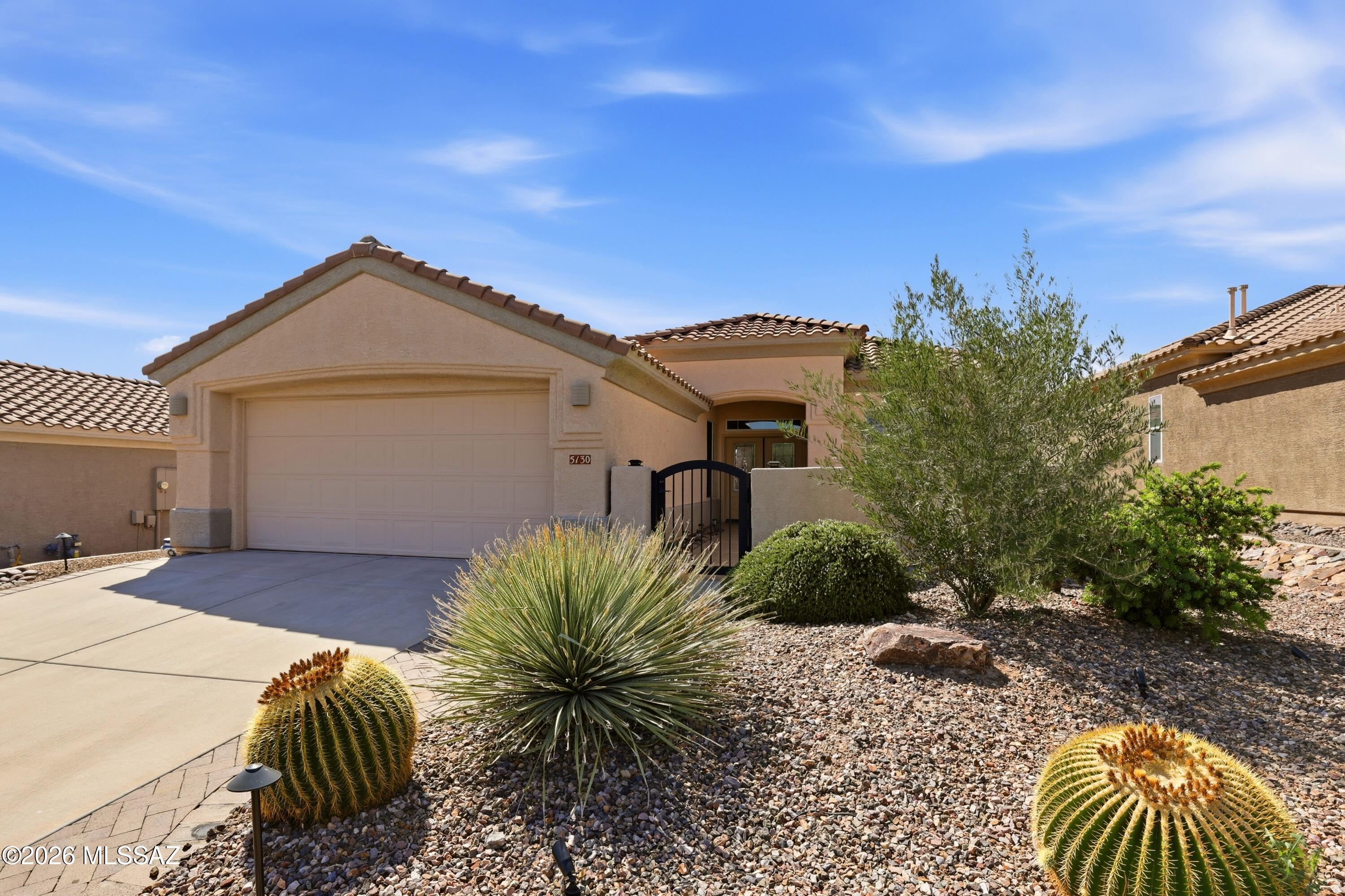 Welcome to the sought-after Extended Hillsboro model in the prestigious Highlands at Dove Mountain -- where luxury, comfort, and effortless desert living come together. This beautifully updated 1,837 sq. ft. home offers 2 bedrooms, 2 baths, plus a versatile office/den, all designed within a hugely open and inviting floor plan perfect for both everyday living and entertaining. Thoughtfully upgraded throughout, the home features gorgeous luxury vinyl flooring, plantation shutters, updated kitchen and baths, newer kitchen appliances, and a new washer and dryer. The garage has been enhanced with durable epoxy flooring, while updated irrigation and landscaping create exceptional curb appeal and easy maintenance.
Enjoy Arizona living year-round on the beautiful covered patio. Enjoy Arizona living year-round on the beautiful covered patio complete with automated retractable screens -- the perfect place to relax and take in the lovely setting and mountain-desert ambiance. Paid solar adds energy efficiency and long-term savings.

Ideally located close to the clubhouse and community amenities, this impeccably maintained home offers the perfect blend of style, function, and resort-style living in one of Dove Mountain's most desirable active adult communities.