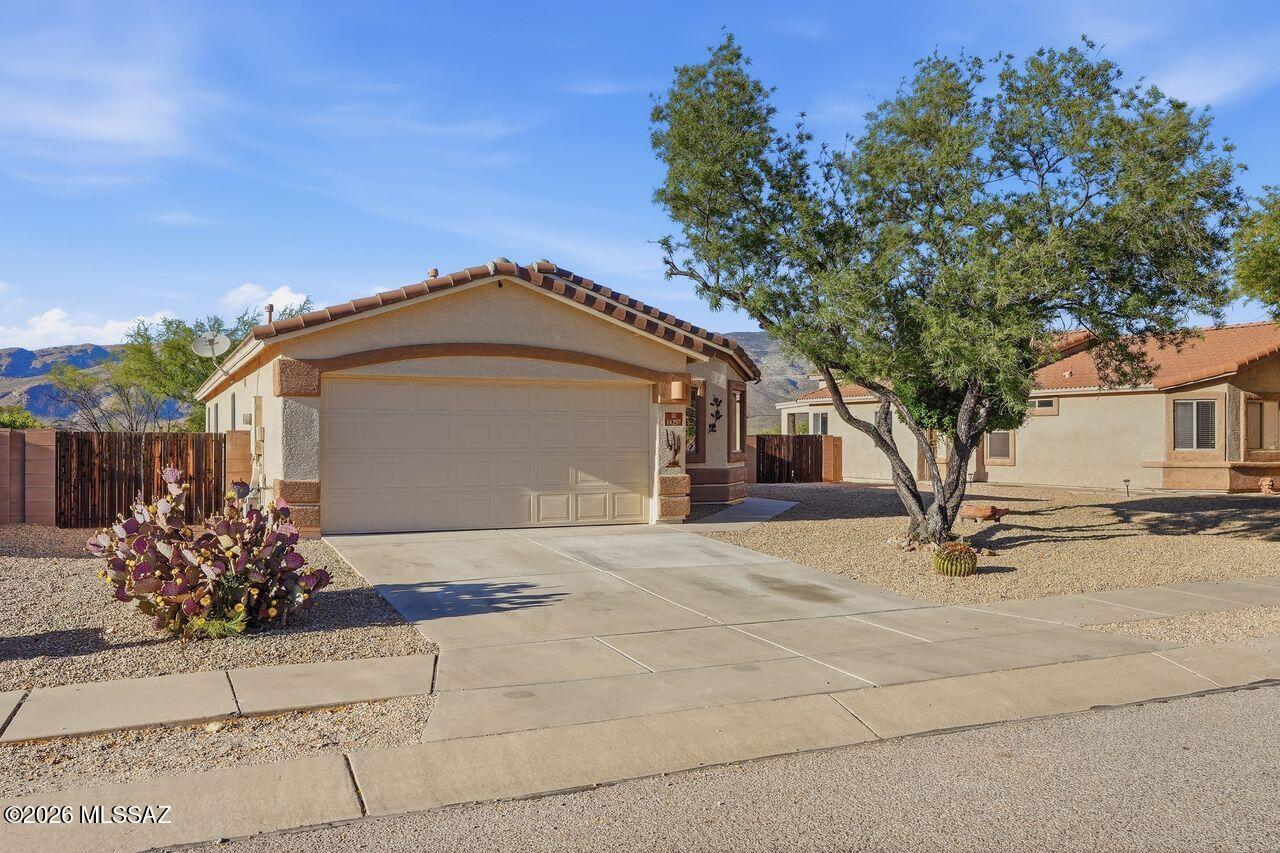 This inviting home features an open floor plan with four bedrooms and two full bathrooms, offering comfort and
flexibility. The fourth bedroom can easily serve as a den or home office. The modern kitchen includes cherry
cabinets with pull-out shelves, granite countertops, stainless steel appliances, a gas range, and a pantry for ample
storage. Enjoy relaxing or entertaining in the backyard while taking in beautiful mountain views. Gate doors or both sides of the house for easy access to the private back yard with no neighbors directly behind. New HVAC in 2024. Located in the highly sought after Vail School District, this home offers access to award-winning schools and a desirable setting.