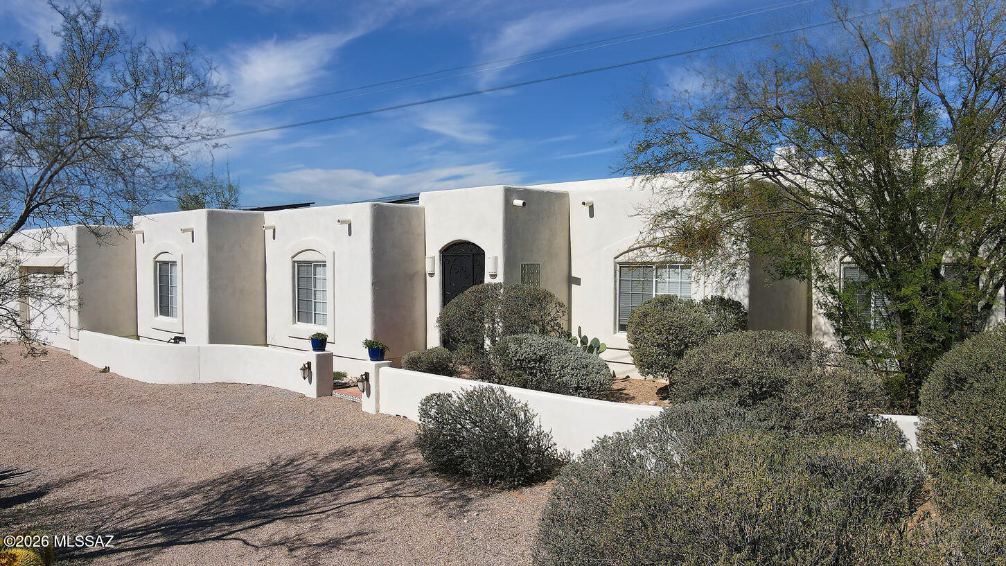 Very special newer home on a spectacular view lot in Flecha Caida Estates. Unobstructed mountain views from this very private yet convenient property. Open floorplan with high ceilings and large windows set the tone for this EZ care home. Enormous greatroom with cozy den area and gas fireplace open to the spacious dining area. All these open to the full length covered porch and oh those views over the natural desert to the majestic Catalina Mountains. Modern kitchen with breakfast bar and eating area. Sweet primary has a huge walk in closet & separate tub & shower. Leased solar keep your electric cost very low. Close to Whole Foods, Library, Restaurants, Basis School, River Walk and so much more. Oversized garage with room for a workshop. Circular driveway. No PB. Pipes were all replaced.