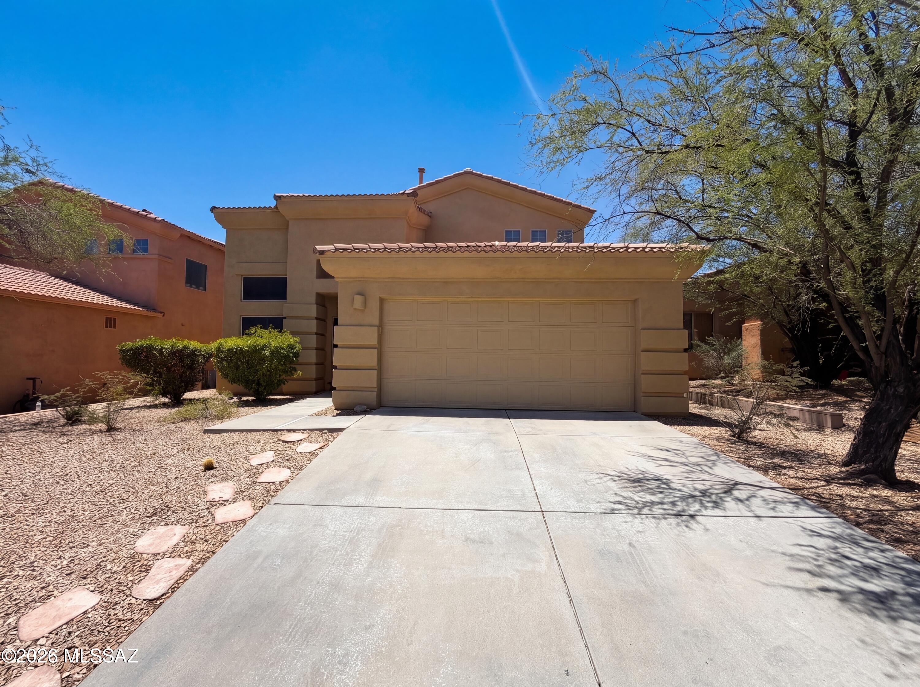 Discover 10431 E Rita Ranch Crossing Cir, a residence recently enhanced with fresh interior paint throughout. The kitchen includes a functional island, and the primary bathroom features double sinks, alongside a separate tub and shower. Outside, a covered patio extends to a fenced in backyard with an in ground pool. An exceptional blend of modern comfort and refreshing outdoor living awaits.. Included 100-Day Home Warranty with buyer activation