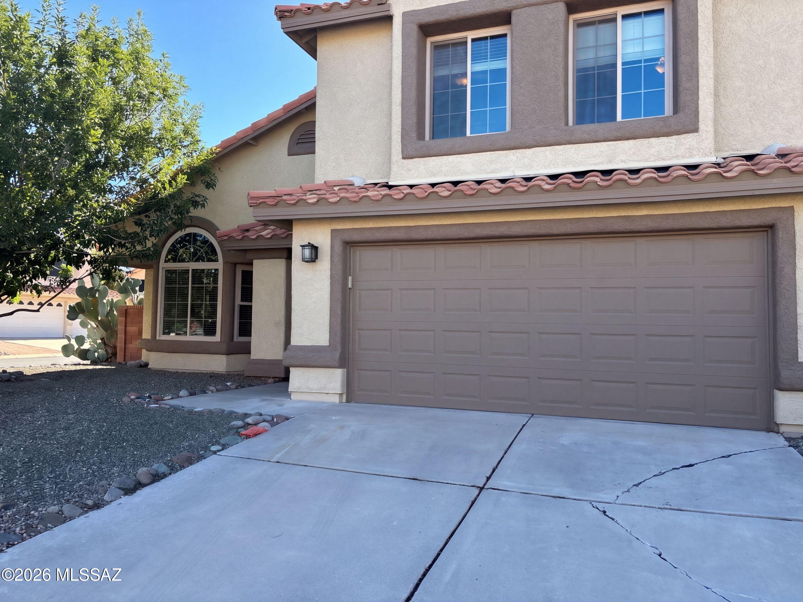 INCREDIBLE BUYER INCENTIVES: $8,000 MORTGAGE CONCESSION. Seller will pay up to $8,000 at closing towards your interest rate buydown if you finance with lender of sellers choice.

851 W Port Royal Pl is a two-story Tucson home with a pool, a covered patio and separate living and dining spaces. The kitchen pairs a peninsula with stainless steel appliances and a window-lined breakfast nook. A fireplace anchors the rear living room, while the front dining area rises to a double-height ceiling. Upstairs, the primary bedroom connects to a bathroom with double sinks, a soaking tub and a separate shower. A main-floor office is set apart from the main living areas. The covered patio faces the pool and surrounding yard. Laundry facilities and an attached two-car garage complete the layout. Include