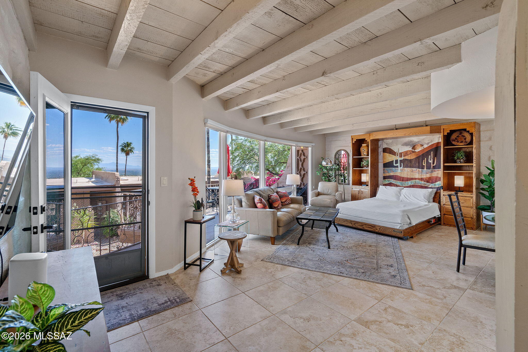 Experience elevated desert living in the prestigious Skyline Country Club. This versatile two-unit townhome offers ideal flexibility for multi-generational living, seasonal use, or rental income. Unit 1 features a spacious bedroom, kitchenette, private bath with walk-in shower, and its own washer and dryer. Unit 2 offers an expansive living area, full kitchen, and large bath with walk-in shower. A private interior pass-through allows seamless use as one home or two separate dwellings. Both units enjoy private balconies with stunning city lights and mountain views. Located in a guard-gated community with golf, pickleball, tennis, and a clubhouse with pool--perfect for a lock-and-leave lifestyle or smart investment.