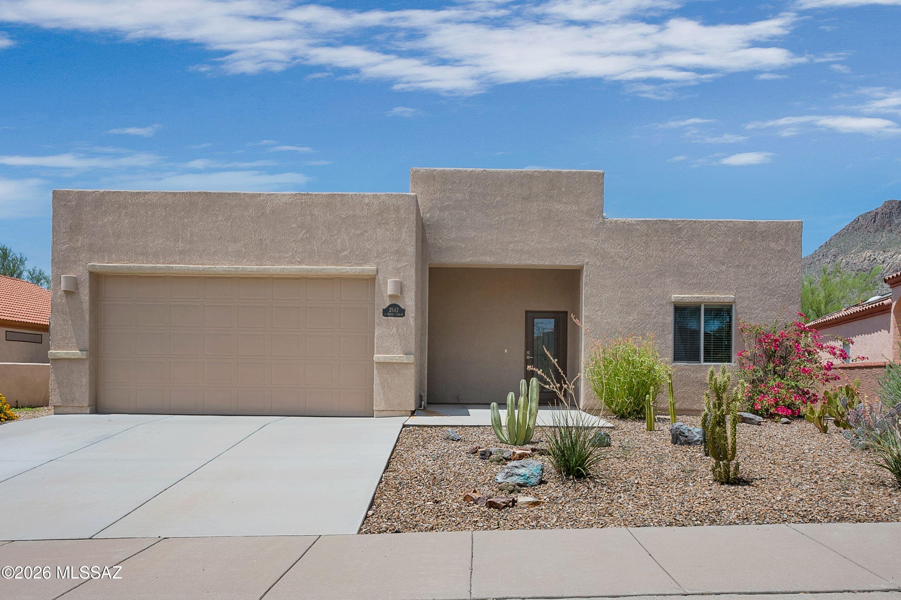Set against the picturesque Tucson Mountains, this beautifully appointed home offers the perfect combination of modern design, energy efficiency, and everyday comfort. The spacious, open layout is highlighted by soaring ceilings that create a bright and airy atmosphere, while the well-designed kitchen features an oversized island that seamlessly connects to the living area, ideal for entertaining or casual gatherings.

Enjoy the beauty of the surrounding desert with convenient access to walking trails right from the community, making it easy to explore the stunning landscape just steps from your front door. Designed with both comfort and efficiency in mind, this home also includes a fully owned solar system, allowing you to enjoy lower energy costs from day one...(continued) With breathtaking mountain views and contemporary finishes, this move-in-ready home offers the very best of Tucson living.