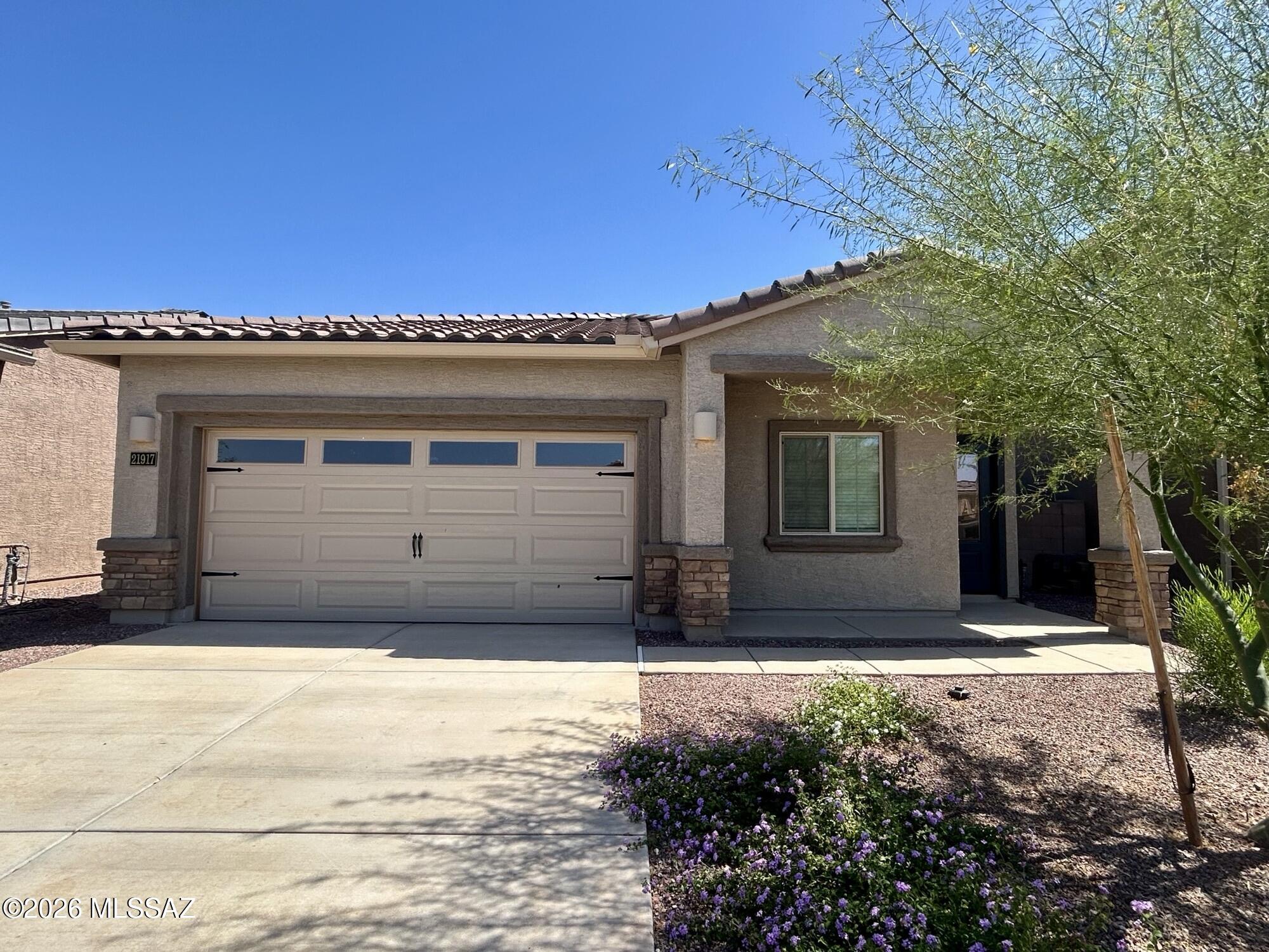 The Payson plan boasts a spacious 4-bedroom, 2-bathroom layout that's designed for comfort & togetherness. As you approach this home, the eye-catching exterior details, featuring a stylish tile roof, contemporary coach light, and a charming ¾ lite front door, set the tone for what awaits inside. Step through the door and be enchanted by the seamless flow of the Payson floor plan. A chef-ready kitchen takes center stage, overlooking the expansive dining area & inviting family room, creating the perfect space for gatherings & everyday living. When it's time to extend the celebration outdoors, you'll appreciate the generous covered back patio & the serenity of your private back yard. It offers a harmonious blend of style & functionality, making it the ideal residence for you and your family.