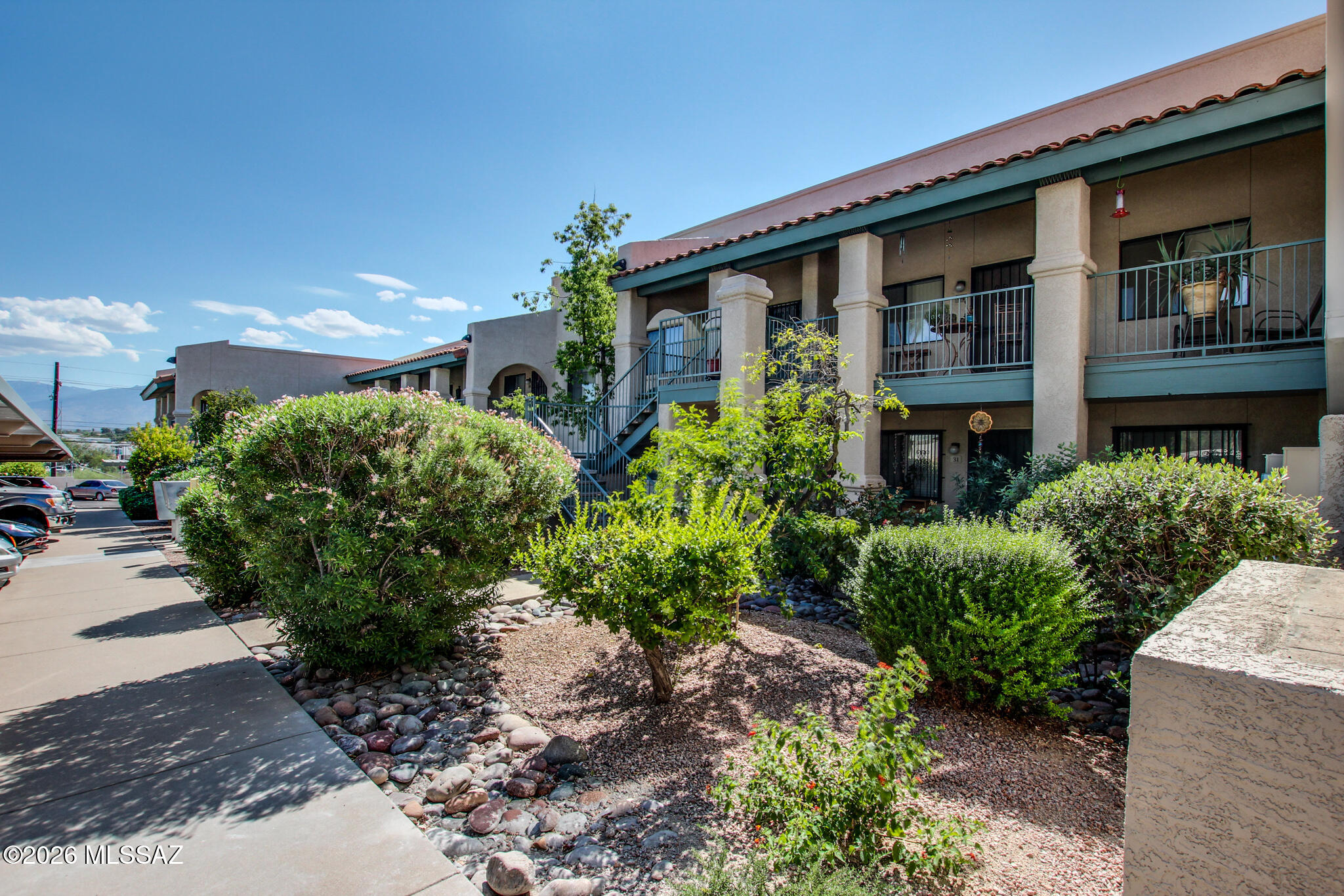 Welcome to Ridge 22 Condominiums. This 1-bedroom, 1-bath, second-story condo has an in-unit stackable washer and dryer. Enjoy a private balcony with mountain views and an added security wrought-iron gate. HVAC was replaced in 2019. The low HOA ($235) covers water, sewer, garbage, roof repair, landscaping, and exterior maintenance. Community amenities include two swimming pools, a spa, and a dedicated parking space. Rentals allowed.
