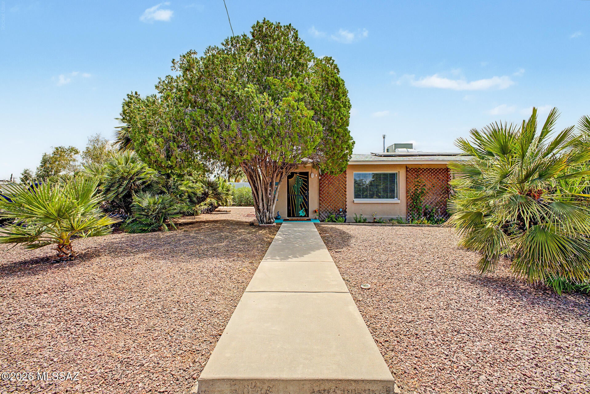 Fall in love with this adorable CORNER LOT home in Tucson! Fantastic curb appeal with attractive landscaping. The interior showcases inviting living areas ready to welcome you and your loved ones, with wood laminate flooring, a neutral palette, and plenty of natural light, making every space perfect for entertaining and relaxation. The impeccable kitchen is complete with shaker-style cabinetry, tile backsplash, granite countertops, and built-in appliances. You'll have a screened-in patio perfect for enjoying your morning coffee, and a spacious backyard with a paver patio, ideal for weekend grills and peaceful evenings. What's not to love? Make it yours!