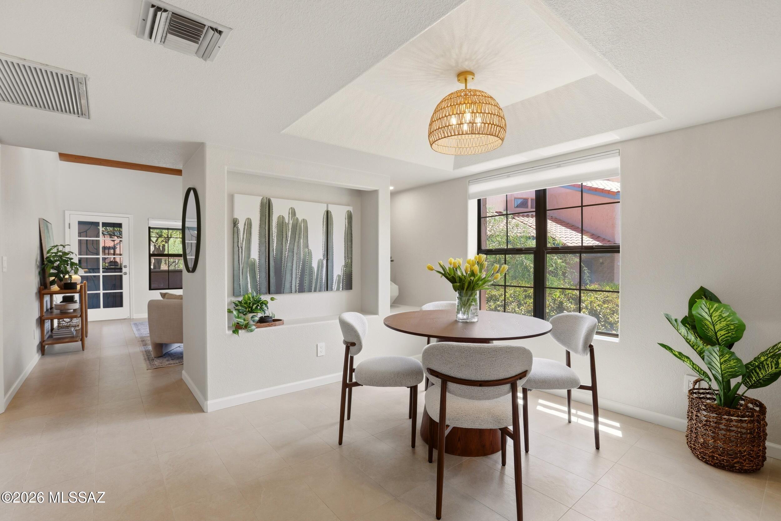 Fully renovated end-unit 2 bed, 2 bath townhouse tucked into a quiet corner at the base of the Catalina Mountains. A rare opportunity to enjoy a freshly designed and thoughtfully updated home in one of Tucson's most coveted locations. Inspired by the colors and textures of the Sonoran Desert, carefully selected finishes create a warm and inviting interior. Resort-style amenities include winding paths, mature trees, tranquil water features, heated pools and spa, fitness center, pickleball, tennis, and an active clubhouse. Just minutes from Sabino Canyon, enjoy effortless access to hiking, outdoor adventure, dining, shopping, and everyday conveniences while still feeling worlds away. Curated furnishings and decor available on a separate bill of sale. Agent-owner.