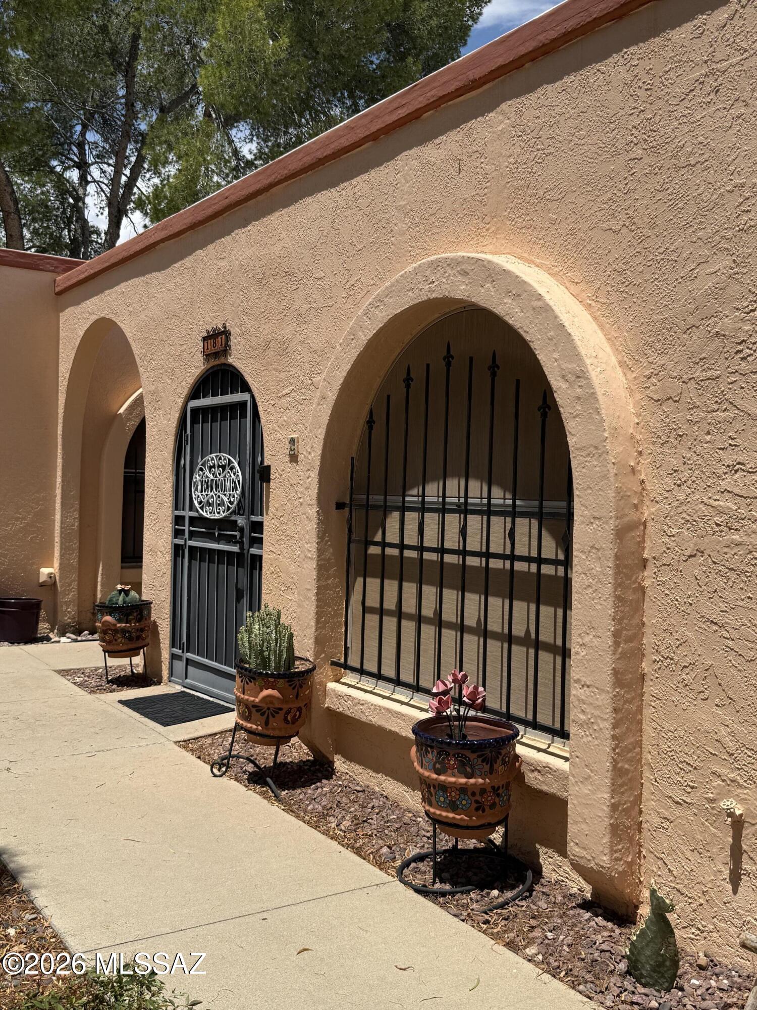 Welcome to this charming and beautifully maintained condominium nestled in the heart of Green Valley, Arizona! This adorable 1-bedroom, 1-bath, end unit offers the perfect blend of comfort, convenience, and cozy desert living. Tucked within a peaceful community, you'll love the inviting shared courtyard filled with mature shade trees. Ideally located within walking distance to the Continental Mall shopping plaza, you'll have easy access to shopping, dining, and everyday conveniences right at your fingertips. This end unit provides added privacy and is just a short stroll to the community pool, making it easy to enjoy resort-style living year-round.