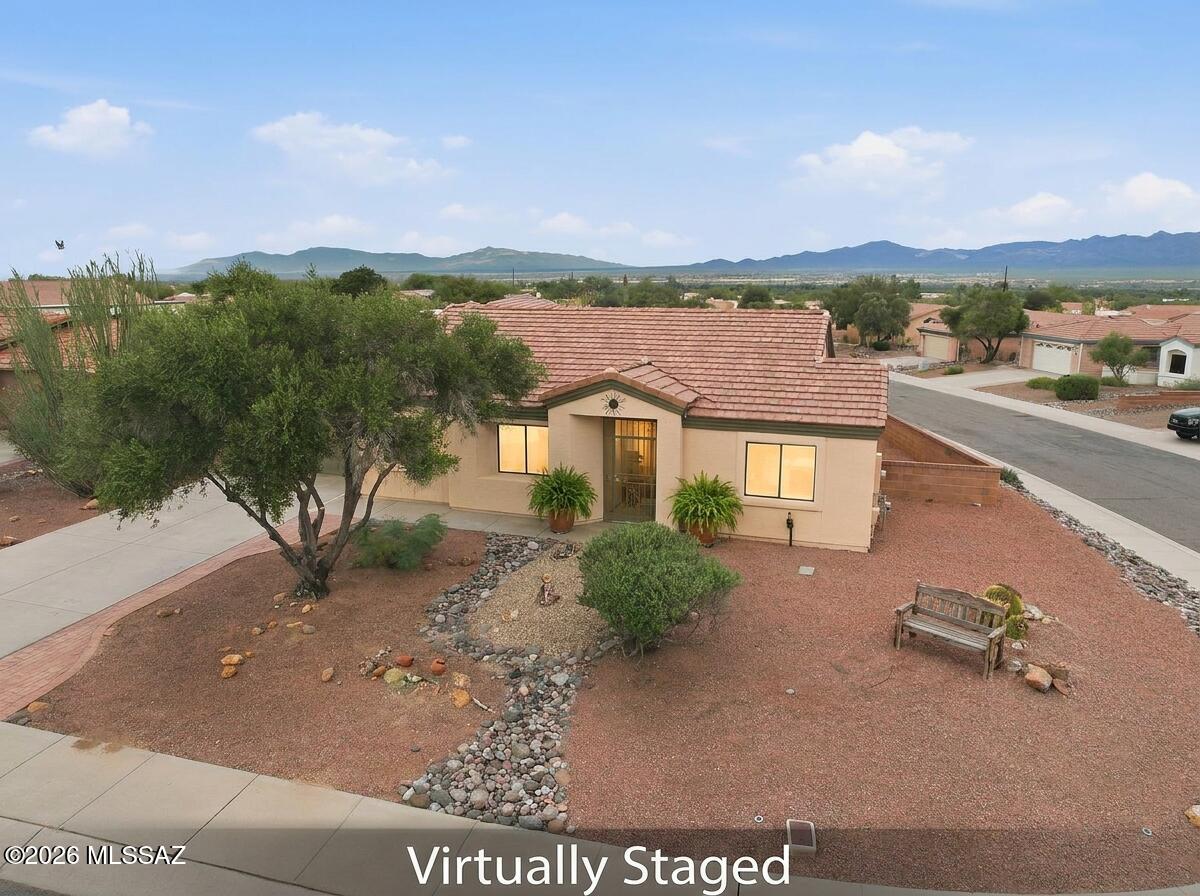VIEWS, VIEWS, and more VIEWS! Your desert oasis awaits in this stunning, move-in-ready home, where every sunrise and sunset is a show and the mountains are always center stage.
Step into the backyard and exhale. This extra-large corner lot offers rare privacy and room to make it yours: gather around a fire pit under a canopy of desert stars, soak in a hot tub with the mountains as your backdrop, plant a garden, or fire up the grill for unforgettable BBQs with family and friends. Low-maintenance desert landscaping means more time enjoying the view and less time on yard work. The updated kitchen is a showpiece, with brand-new quartz counters and sparkling appliances, ready for everything from morning coffee to holiday feasts. The adjacent dining room puts those mountain views right at your your table, so every meal comes with a backdrop no restaurant can match.At the front of the home, the lovely living room strikes the perfect balance: cozy enough for intimate movie nights, yet inviting enough to entertain.Your spacious primary suite is a true retreat, featuring brand-new counters and sinks and a walk-in shower. The guest bedroom is currently staged as a den, but it is equally ideal for overnight visitors, a home office, or a hobby room. Homes with this many thoughtful upgrades, this much outdoor space, and views this spectacular are rare at this price. The work has already been done, so there is nothing left to do but unpack and unwind. Whether you're looking for a winter getaway, a full-time residence, or a lock-and-leave escape, this incredible desert gem delivers!