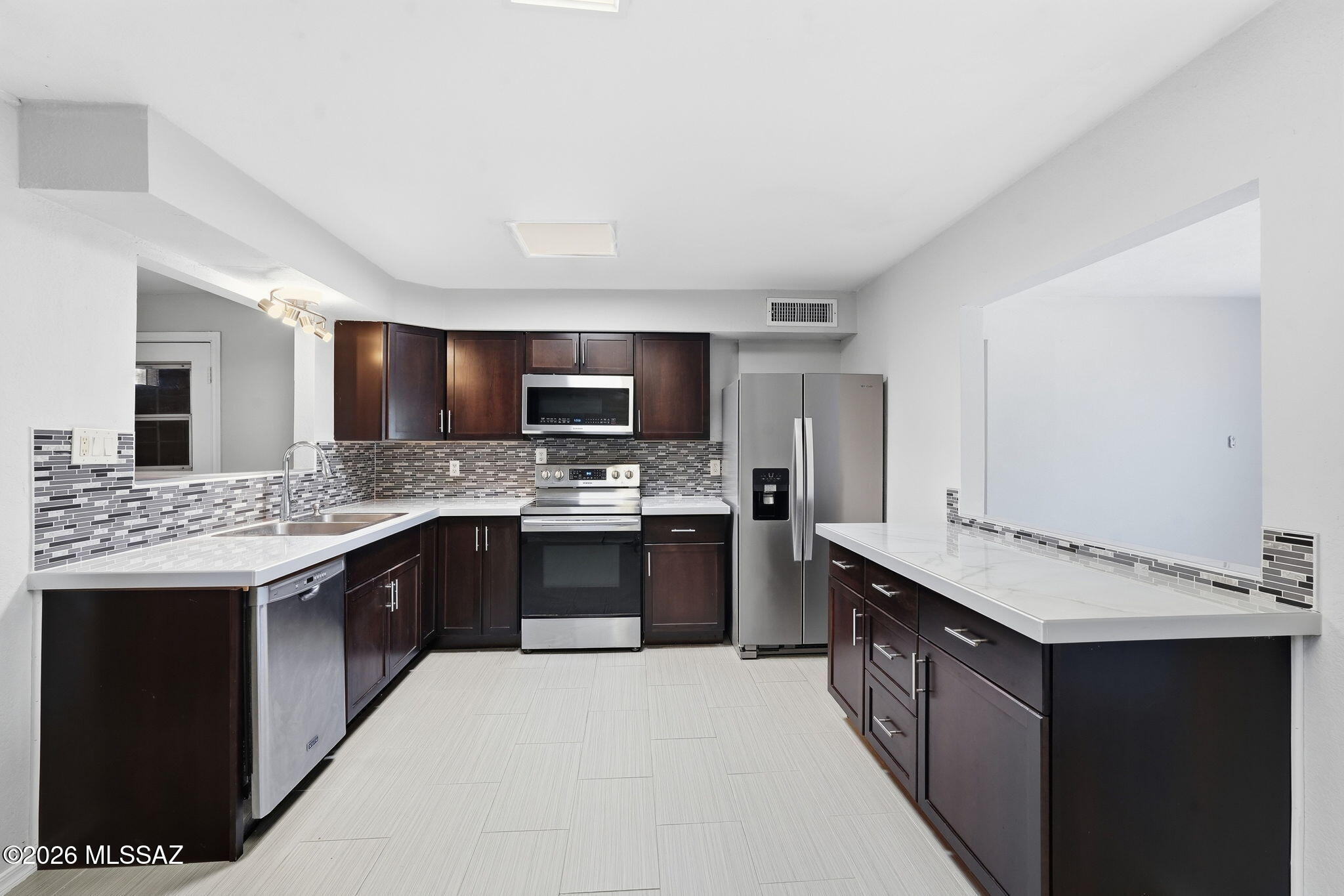 Fully remodeled in 2022, this move-in ready 3BD/2BA home shines with modern upgrades throughout. Enjoy a new HVAC system with 10-yr warranty, LVP and tile flooring, and beautifully updated bathrooms featuring new vanities, mirrors, cabinets, tile, shower door, and contemporary lighting. The semi-open kitchen offers new Java cabinets, porcelain tile countertops, breakfast bar, and dedicated dining area. All appliances stay--plus a 2024 washer. LED lighting, window security bars, and a quiet cul-de-sac location add comfort and peace of mind. No HOA, and a large park with picnic area and playground sits right across the street.