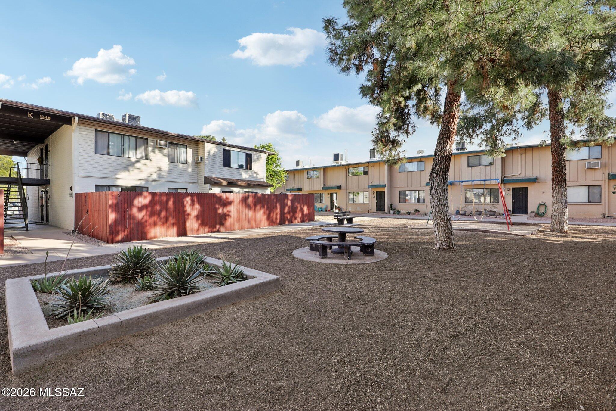 Welcome to this beautifully maintained co-op townhouse in Tucson! This well-kept unit features an updated kitchen, energy-efficient double-pane windows, and a private covered patio that is incredibly convenient to parking. Step outside to enjoy the community pool and the impeccably maintained grounds. Exciting things are happening in the community: under the guidance of a proactive new HOA management team, the property is currently undergoing a series of fantastic upgrades. This includes brand-new siding on all buildings, with this specific unit scheduled to be completed very soon! Enjoy true maintenance-free living, as your monthly fee covers heating and cooling, water, gas, exterior roof, and common areas.
- This is a Co-Op. Cash Purchase Only. Call with any questions you may have.
