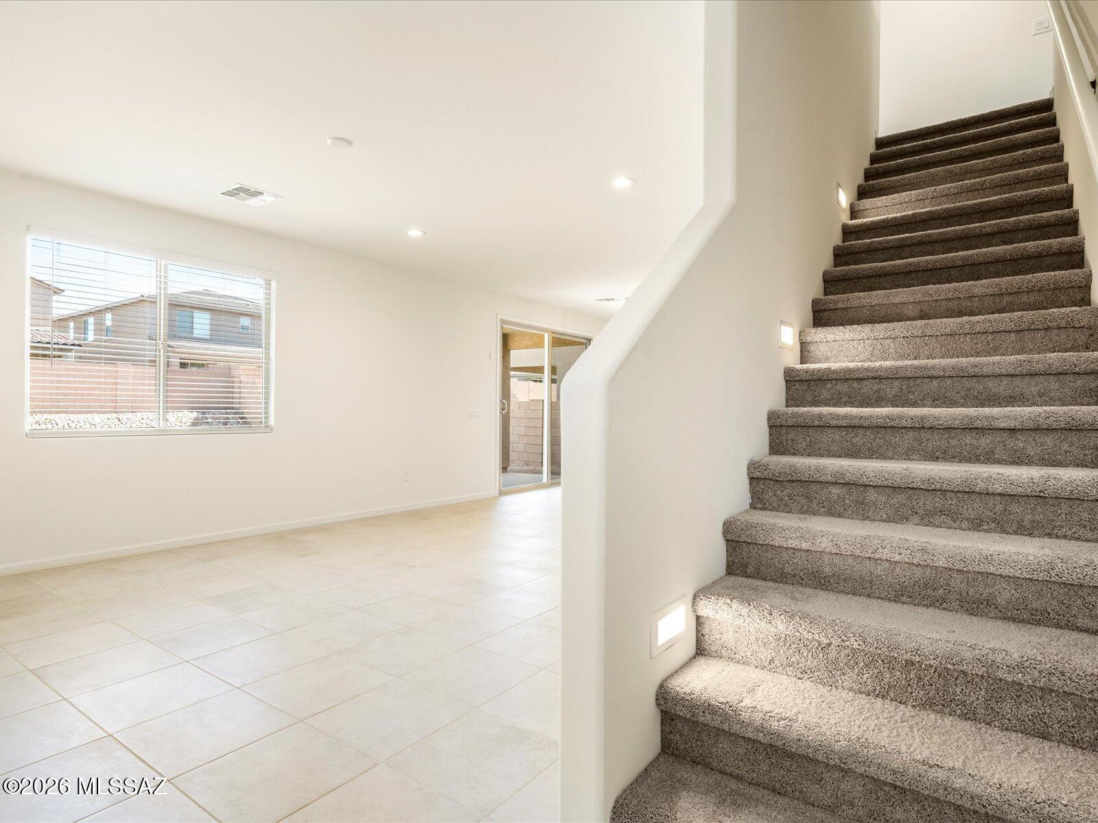 Loft. Energy Efficient. Appliances Included.

This 4-bedroom, 2.5-bath Moonstone floorplan in Tucson, AZ features a desirable first-floor primary suite. Upstairs, a spacious loft provides the perfect opportunity to create the game room, media space, or flex area of your dreams. Located in Las Patrias at Star Valley Phase III - Signature Series, now selling in Tucson, this community is less than 10 minutes from I-10, offering easy access to employment centers and downtown Tucson. Community amenities include walking and biking trails and playgrounds. Move-in ready with washer, dryer, refrigerator, and whole-home blinds. Built with innovative, energy-efficient features for greater savings, improved health, and real comfort.
