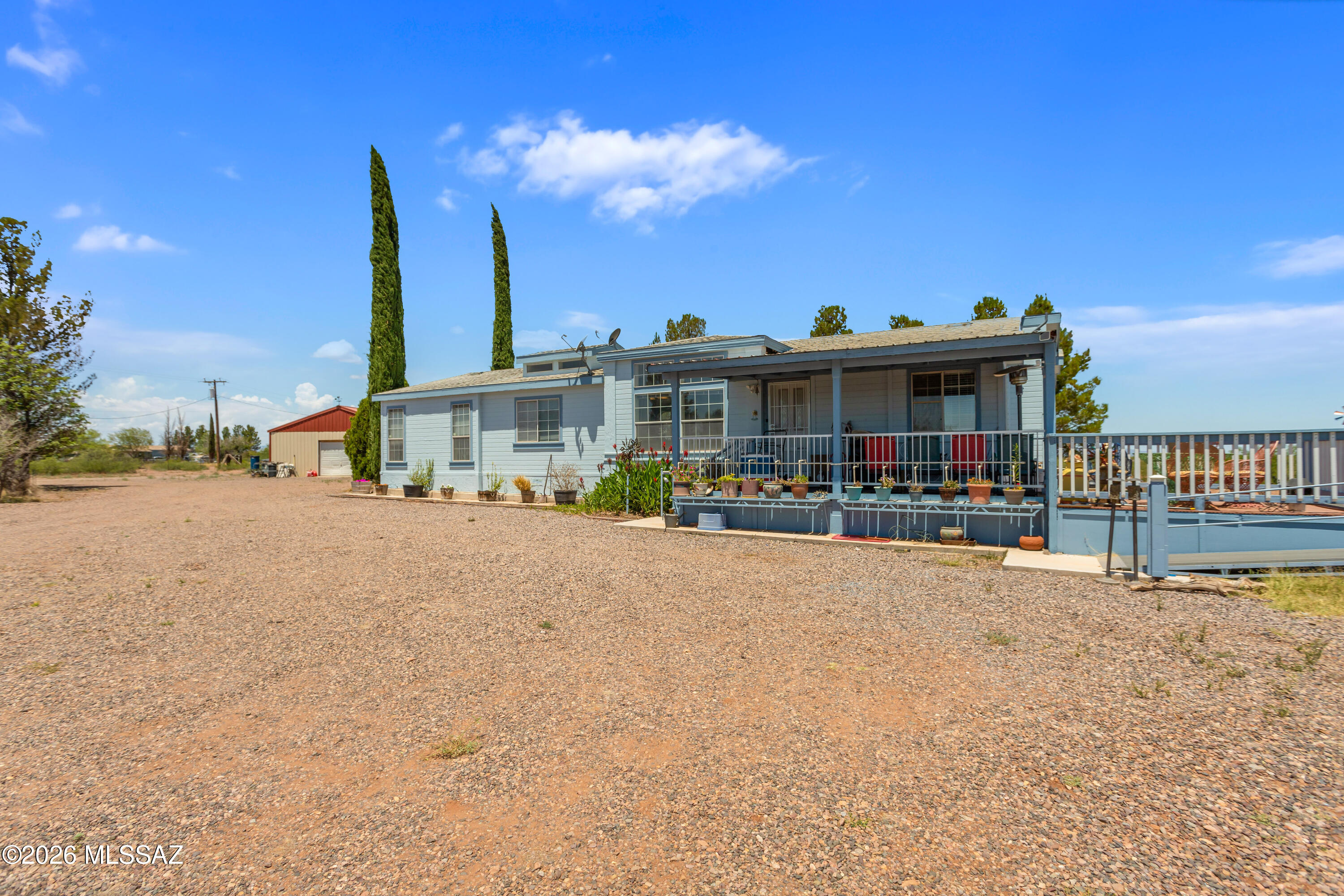 Beautiful country property located near Douglas with sweeping views of the mountains & Douglas city lights. This home features many updates including a newer dual AC/heat system, new exterior paint, a newer well pump and so much more! Outside, you'll find a detached 30x40 workshop complete with power, water, and an evaporative cooler. The 4.79 ac property offers plenty of mature trees on irrigation for low-maintenance enjoyment. Inside features a split floor plan, tile flooring, large windows for natural light, and a spacious primary suite with a walk-in closet. Enjoy relaxing or entertaining on the beautiful decks while taking in the peaceful country setting and stunning views.
