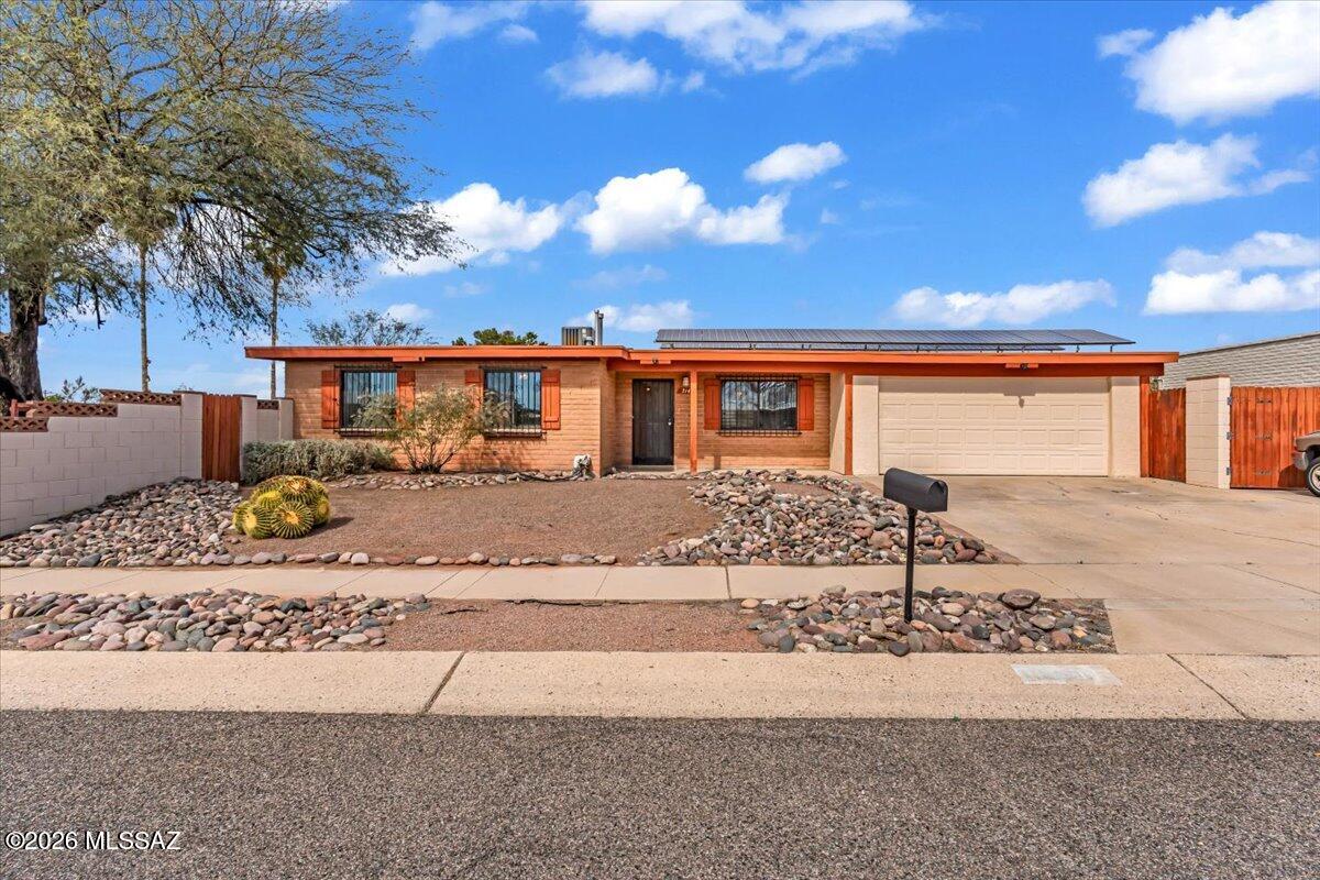 Welcome to this inviting East Side Tucson home, perfectly blending comfort and value. This 3-bedroom, 2-bath residence offers moderate updates throughout, creating a move-in-ready space with room to make it your own.

Inside, you'll find a functional and flexible layout, plus a spacious laundry room with abundant storage, ideal for keeping everything organized. The attached two-car garage adds everyday convenience, while the large backyard offers endless possibilities for entertaining, gardening, pets, or simply enjoying Arizona's beautiful sunsets.

With owned solar, you'll appreciate energy efficiency and long-term savings from day one. Located on Tucson's east side, close to shopping, dining, parks, and schools, this home delivers comfort, practicality, and easy living all in one.