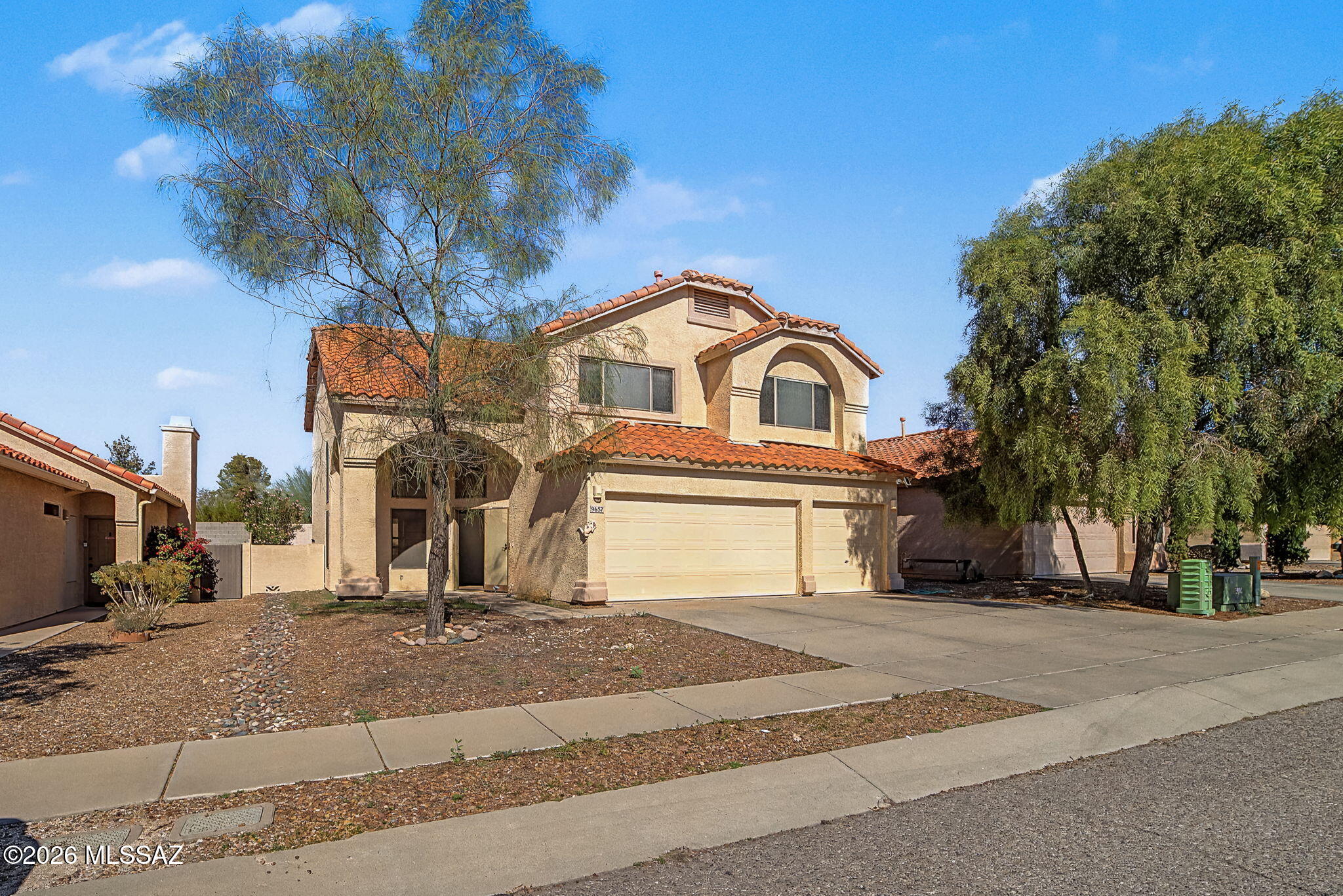 Great opportunity for the largest floor plan in the area! With 4 bedrooms, 2 1/2 baths and a full 3 car garage and level driveway this home is ready for your finishing touches. Soaring ceilings open into entry way, with living and large den off of living room. Cozy fireplace room for family gatherings, and a large open kitchen complement the lower level. Upstairs 4 bedrooms with a secondary den/office/work out space off of primary bedroom for privacy! Tons of natural light throughout. Close to shops, and all that Old Spanish Trail and the East side have to offer.
