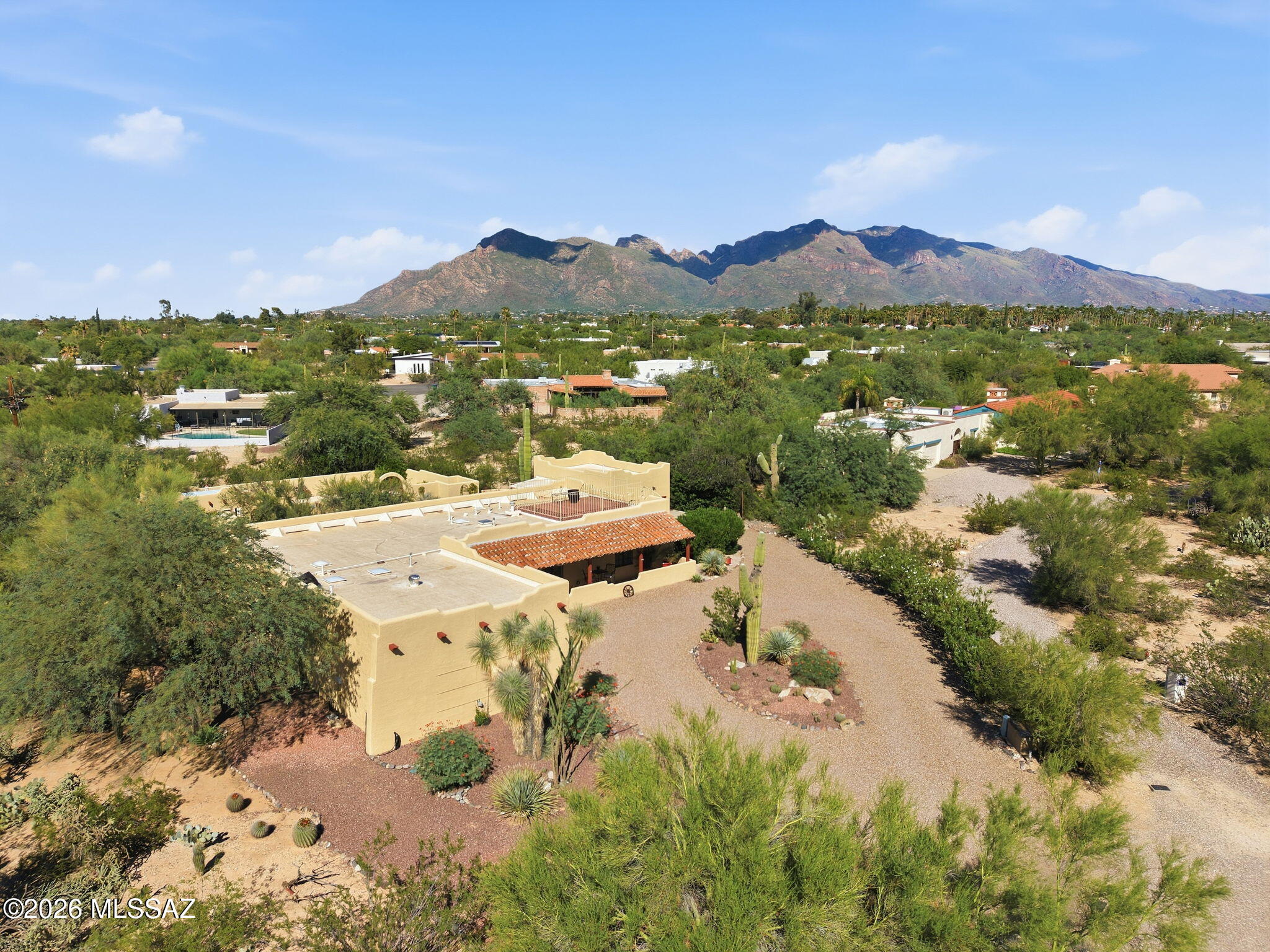 Embrace ultimate Southwestern charm and 360 degree views, with this totally renovated, custom Santa Fe style ranch nestled in Northern Tucson, that has NO HOA!  Delivering a beautifully scaled 3BD/2BA +Sky Deck+Casita+Pool + RV/Boat parking (2,707sqft) home offers both privacy and a fantastic place to entertain guests. Situated at the end of a private cul-de-sac on the neighborhood's largest lot, you enjoy massive physical separation and endless mountain horizons. The jaw-dropping rear grounds (previously featured in Phoenix Homes and Land) is a true oasis you will need to see to believe. Pass through the entrance layout to discover a light-filled open great room floor plan. Designed seamlessly for entertainment, the main living zones merge into an exceptional kitchen workflow. Accommodating 4 bedrooms and 3 bathrooms total, the configuration provides a massive primary wing featuring an electric blind, dual closets, a fully remodeled en-suite bath, and private sliding door access to the back patio. Step out onto a full-length covered patio or ascend the custom rooftop sky deck to take in jaw-dropping, 360-degree panoramic views of Tucson's glowing mountain ranges. Perfectly positioned in Northern Tucson, you enjoy serene neighborhood seclusion that remains just minutes from world-class shopping, grocery hubs, and restaurants.