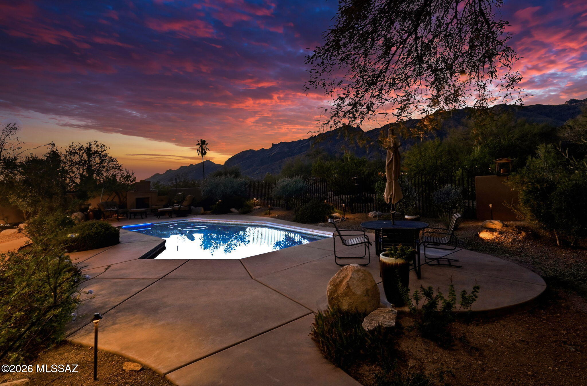 Set in the Foothills with breathtaking Finger Rock views, this fully remodeled home blends elegant modern design with timeless style. Thoughtfully reimagined from top to bottom, it features custom cabinetry, a luxury appliance suite, a desirable split-bedroom floor plan, and a versatile bonus room ideal for a home office, den, or fitness space. Designed for comfortable everyday living, the upgrades are both luxurious and warm. The backyard is a private desert retreat with a sparkling pool, covered patio, view fencing, and an outdoor fireplace, all perfectly positioned to showcase the iconic Finger Rock views. Peacefully tucked away yet just minutes from shopping, dining, and hiking, this exceptional home is a rare sanctuary where every sunset feels unforgettable.
