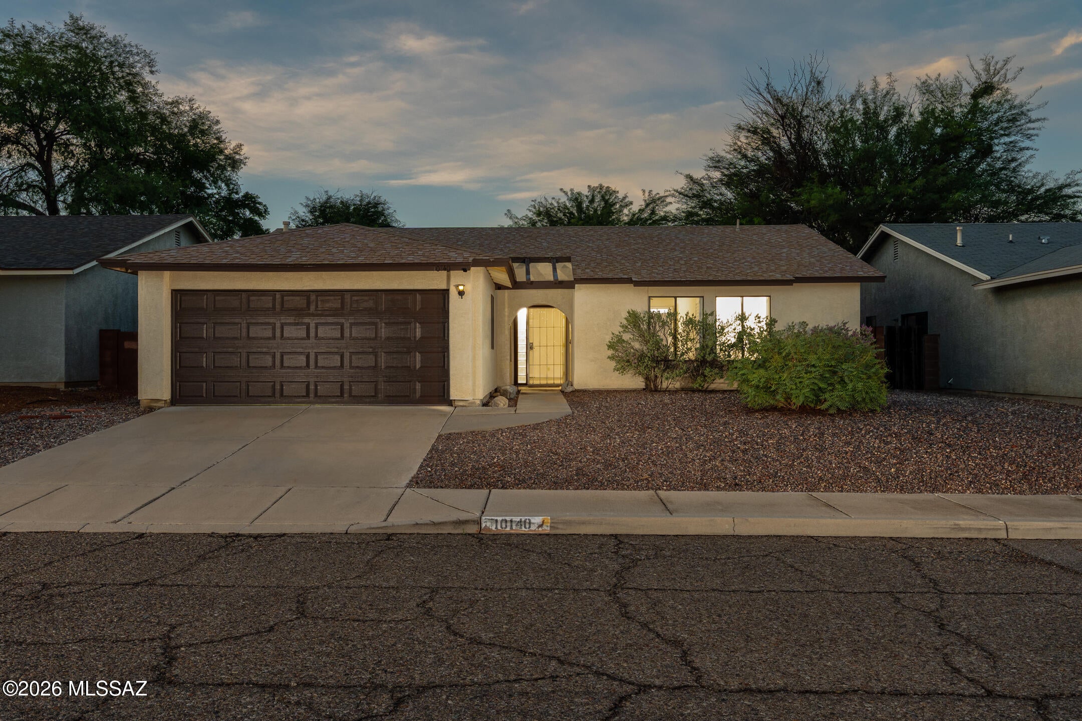 Easy Tucson living awaits in this well-designed 3-bedroom, 2-bath home with 1,413 sq. ft. and a comfortable open floor plan. Tile flooring now extends throughout the entire home, creating a seamless look that's both attractive and easy to maintain. Plantation shutters bring a finished touch to the interior, while custom tile details give the bathrooms added personality. The kitchen offers generous cabinetry and a granite-tile breakfast bar that opens naturally to the living space. Out back, a covered patio overlooks a spacious, low-maintenance yard with plenty of room to relax, entertain, or enjoy Arizona's beautiful weather. A 2-car garage rounds out this inviting eastside home. Your next chapter starts here!