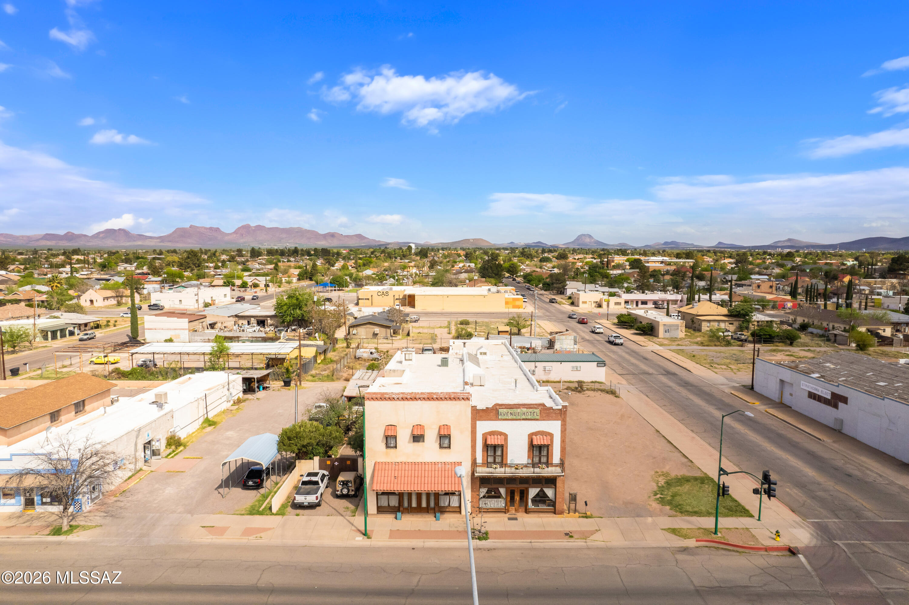 Step into a rare investment opportunity with this historic hotel in the heart of Douglas, rich in character and timeless charm. Originally built in 1901 and expanded in 1915, this iconic property offers a unique blend of history, functionality, and income potential. The hotel features 25 guest rooms along with a welcoming lobby, a fully equipped commercial kitchen, on-site restaurant and bar, and even a classic barbershop--creating a true destination experience. Additional amenities include coin-operated laundry facilities and an inviting outdoor kitchen and entertainment area, perfect for hosting guests and events. Offered furnished and equipped with the essential items for daily operations, this turnkey property is ready for its next chapter. Whether you're looking to restore historic a historic landmark, expand a hospitality portfolio, or create a boutique experience, this one-of-a-kind property delivers unmatched potential in a prime location. *Paintings, Decor, Knick-Knacks and Taxidermy animals do not convey*