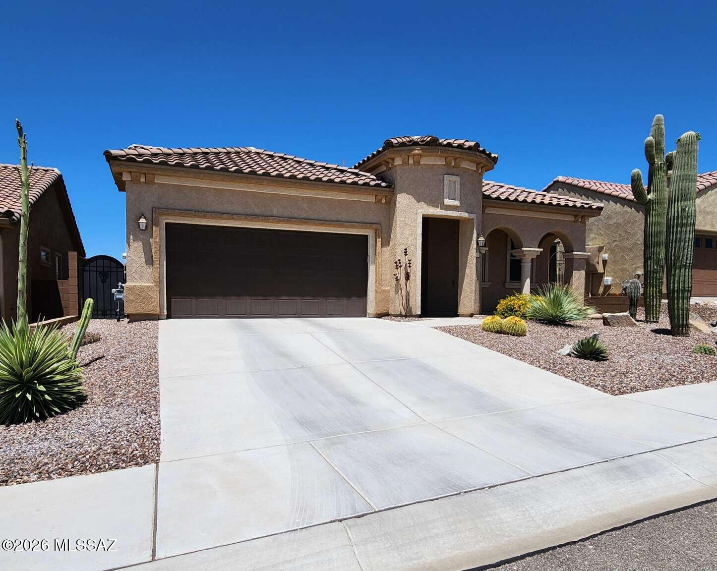 Enter great room filled with natural light, beautiful views, plus an entertainment wall with electric fireplace. The gourmet kitchen has alder wood cabinets, SS appliances, large island & electric cooktop also plumbed for natural gas. This house has custom granite, window coverings, lighting/plumbing fixtures & high ceilings. Large master suite with gorgeous bathroom & large walk-in closet. Inviting guest room & full bath. Laundry room has extra sq ft for office, hobby, exercise room or man cave, change space for your own needs. Backyard oasis has a covered patio, artificial turf, gorgeous landscaping & space for entertaining. Premium lot has common space in front & behind. Community amenities include courts, exercise room, spa & resort style pool in active 55+.FAHW 1yr warranty included