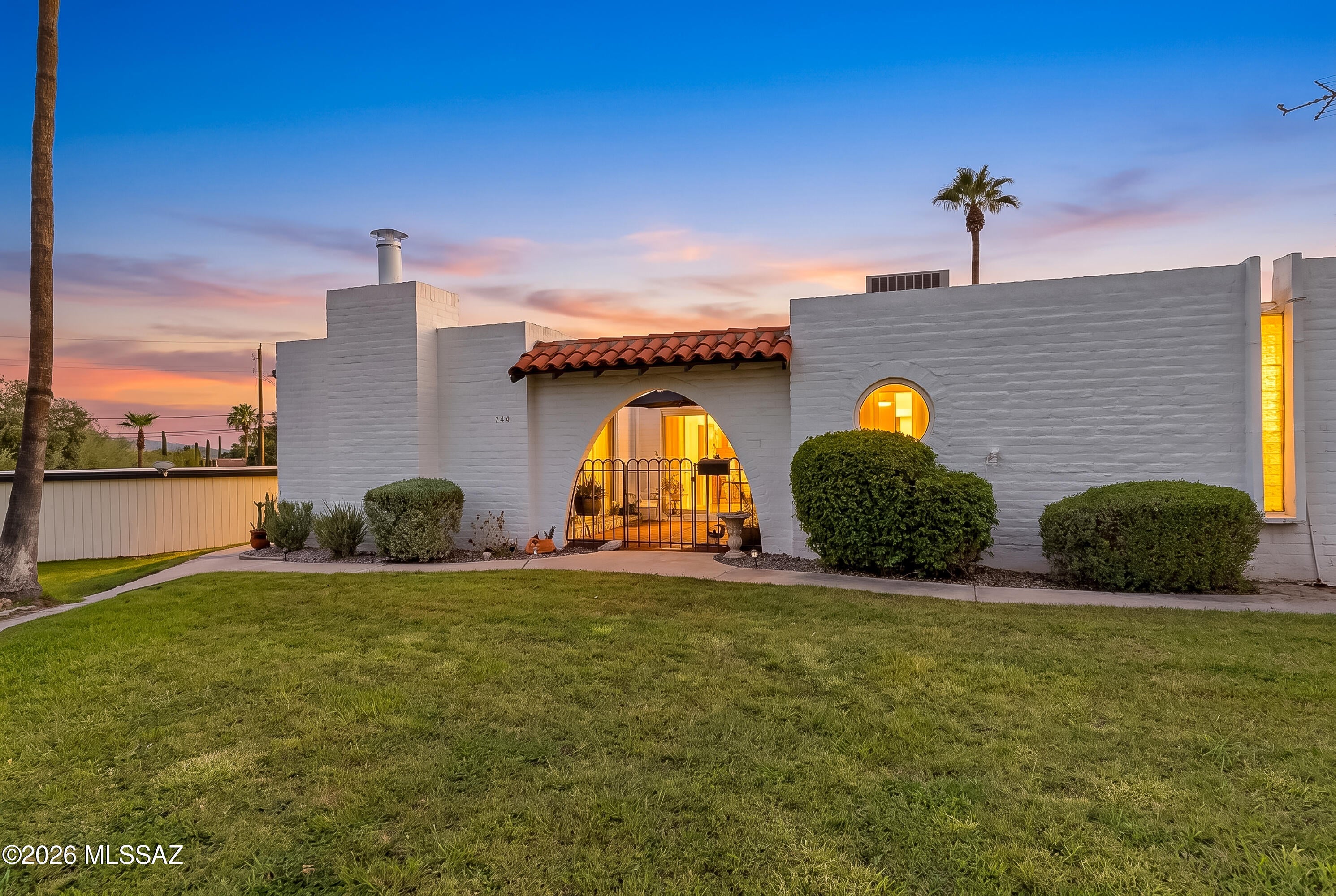 Discover historic charm in this 55+ condo community designed by renowned architect Bennie Gonzales. Casitas De Castilian is nestled on 17 lush acres off Oracle Rd & Roller Coaster. This home offers private front & back patios, beautiful luxury vinyl plank flooring, a 
cozy fireplace, a 2023 water heater, & a 2022 HVAC system. Enjoy significantly lower property taxes thanks to the community's beneficial historic designation. Outstanding neighborhood amenities feature two pools (one heated year-round), tennis court, & an active clubhouse. The comprehensive HOA fee includes water, sewer, garbage, blanket insurance, streets, & building & grounds maintenance, offering a truly carefree lifestyle in a prime, highly convenient location.