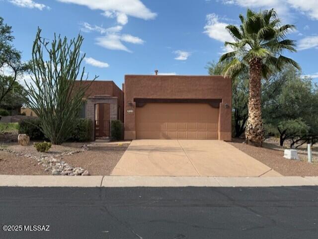 Welcome to the sought-after Barrio de Tubac community. This exceptional Trails Head home showcases sweeping mountain views, unmatched privacy and a setting that borders open common areas. Oversized Anderson windows flood the interior with natural light, while a beehive fireplace creates a warm and inviting living space. Step outside to take in spectacular sunsets over the Santa Rita Mountains or enjoy the shops and galleries of artistic Tubac just a short distance away. Recent updates include new bedroom carpeting and fresh interior paint. Additional highlights are a spacious laundry room with sink, a welcoming entry courtyard, and a covered back patio perfect for outdoor living.  This home is truly a must-see.
