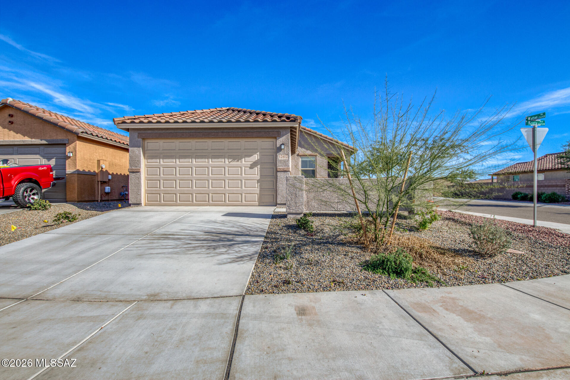 Welcome to this new KB Home situated on a premium corner lot with no neighbors behind, offering added privacy and an open peaceful setting. Lightly lived in and meticulously maintained, this home still includes all applicable builder warranties, providing peace of mind and the benefits of new construction without the wait. The curb appeal is exceptional, highlighted by professional landscaping in both the front and backyard and a spacious 2-car garage. Step inside to an inviting open concept floor plan designed for both everyday living and entertaining. The interior features neutral paint, abundant natural light, plush carpeting and tile flooring in all the right places. The modern kitchen is the heart of the home, showcasing rich mocha cabinetry, stainless steel appliances.