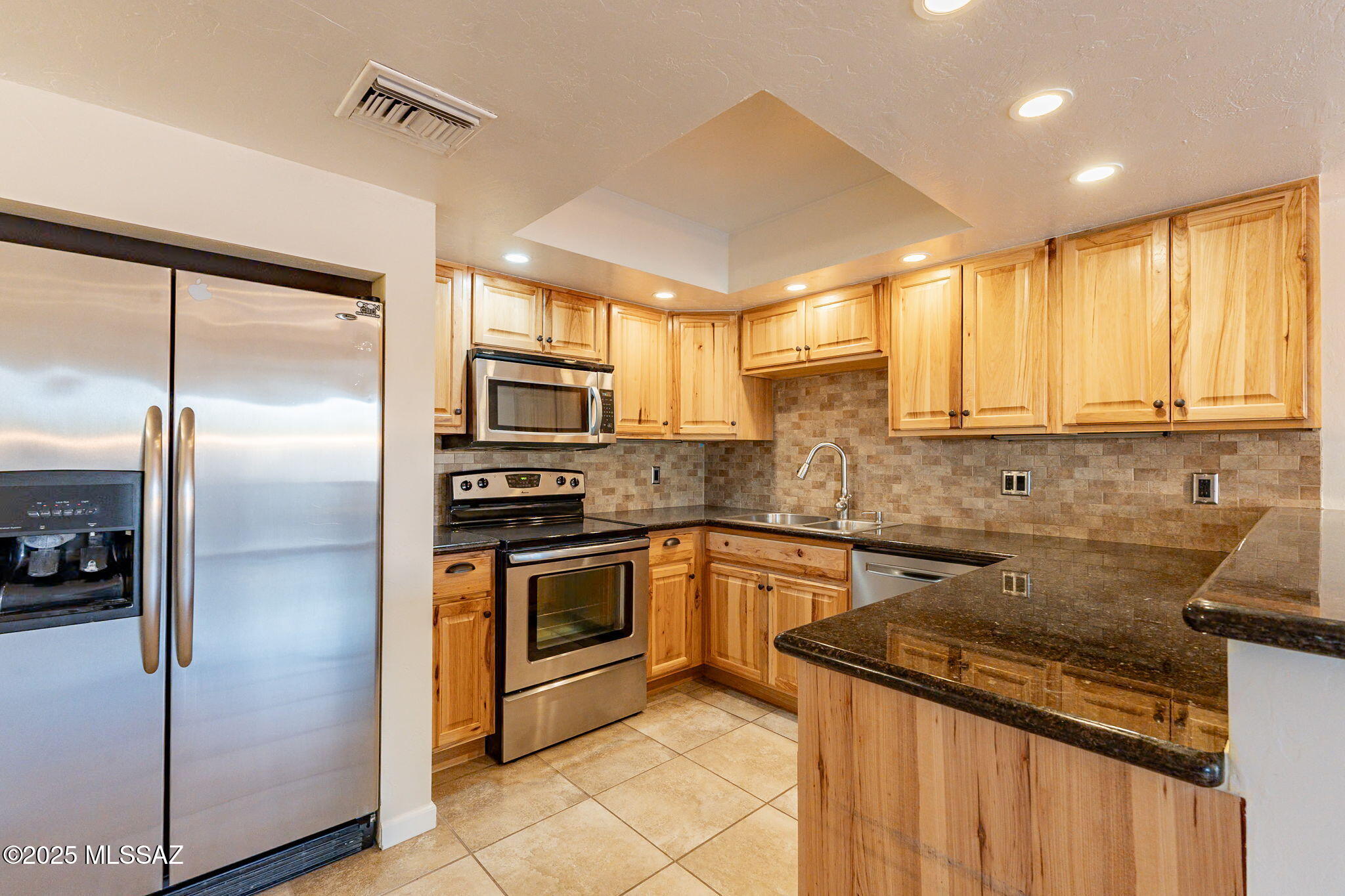 Beautifully updated 3-bedroom, 2.5-bath condo, where comfort and style meet. This home offers spacious living and contemporary design. Tastefully updated décor and thoughtful finishes throughout. Enjoy generous living areas, perfect for entertaining or relaxing in comfort. The kitchen boasts sleek stainless steel appliances, complemented by elegant hickory cabinets that provide both warmth and plenty of storage. Mini-splits installed upstairs for additional climate control and comfort. The primary suite offers ample space & natural light. A spacious closet and beautifully updated Primary suite bathroom make it the perfect place to relax and recharge. Additional closets and storage space throughout the condo help keep everything organized. Plus a spacious two car garage.