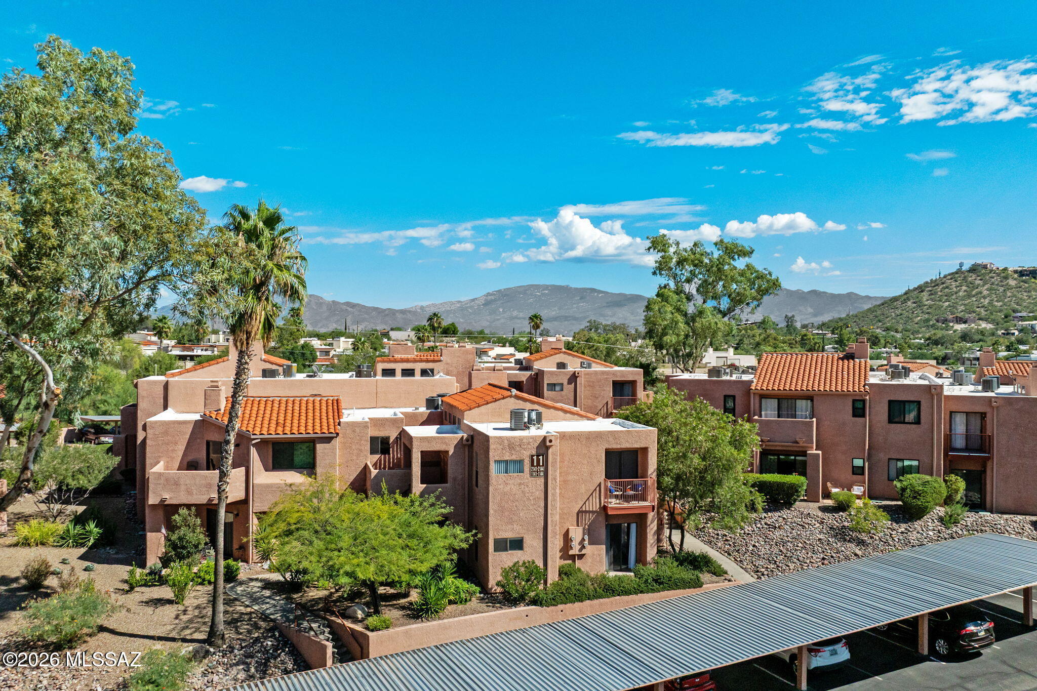 Enjoy Catalina Foothills living in the gated community of Ventana Vista! This 2-bed, 2-bath condo features new HVAC (2026), new roof (2025), a split-bedroom floorplan for added privacy, upgraded kitchen & bathrooms, recessed lighting & tile flooring throughout. The living room offers a tray ceiling & wood-burning fireplace, adding character and warmth. Step outside to a quaint back patio, perfect for enjoying your morning coffee. Just steps from the community pool, clubhouse & amenities, with an HOA that covers water, front yard landscaping, exterior maintenance, pest control & more. NO RENTAL RESTRICTIONS! Conveniently located near Sabino Canyon Recreation Area, shopping, dining & located in District 16 schools.