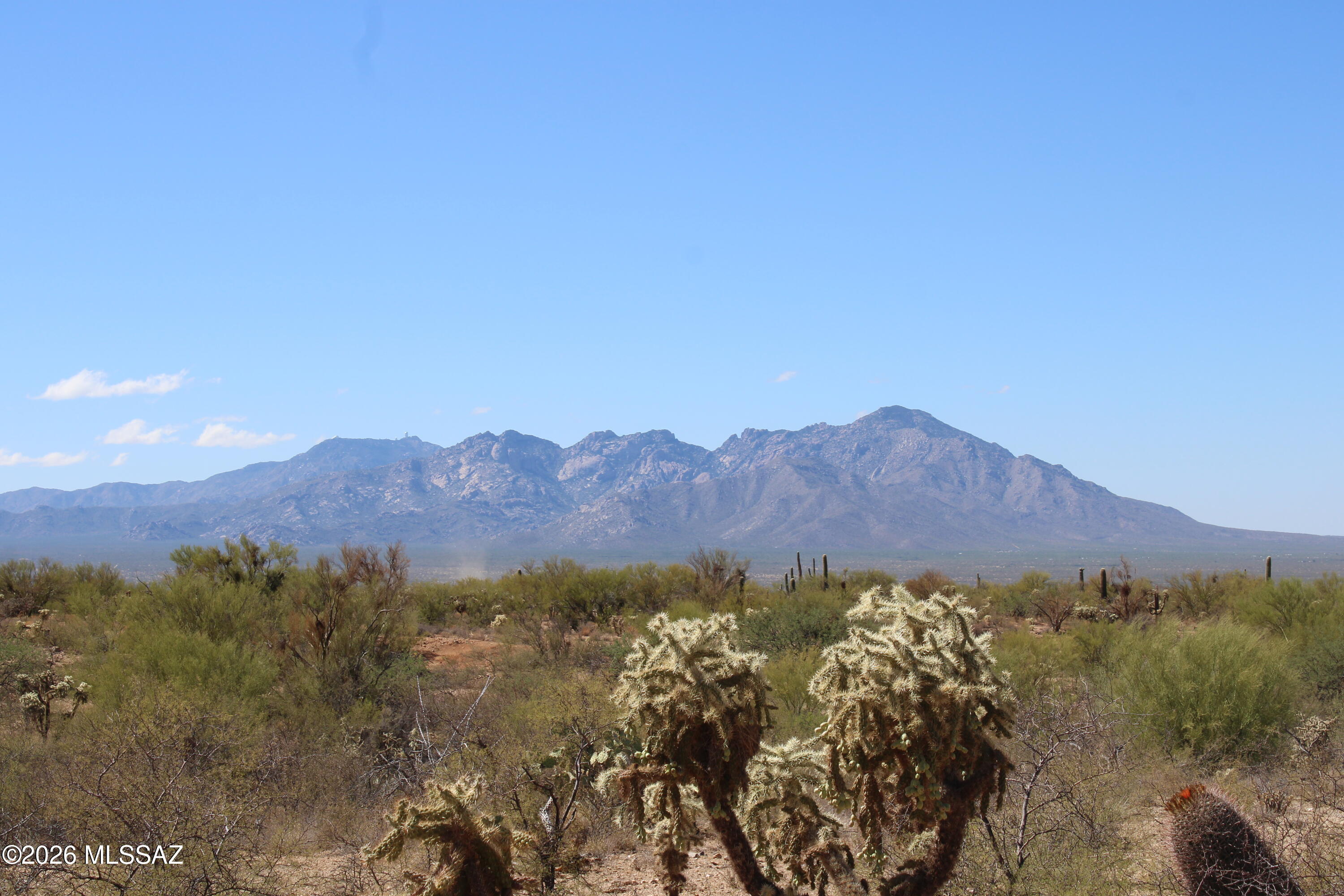 Build your dream home or invest in wide-open desert on this 1.371-acre (59,710 sq ft) vacant lot in the Diamond Bell Ranch area of
Tucson. The property sits across from Arizona State Land Trust, providing enduring open space, privacy, and unobstructed desert views. Enjoy sweeping
panoramic mountain vistas of the nearby Sierrita Mountains, including views of iconic Kitt Peak and the majestic Baboquivari Peak Wilderness, known to
the Tohono O'odham Nation as ''La Bestia,'' a sacred landmark. Bonus opportunity: the adjacent parcel at 14223 S Shaw Rd (APN 301-67-330) is also
available, offering 1.203 acres (52,403 sq ft)—ideal for expanded acreage and flexibility. Buyer to verify zoning, utilities, and access.