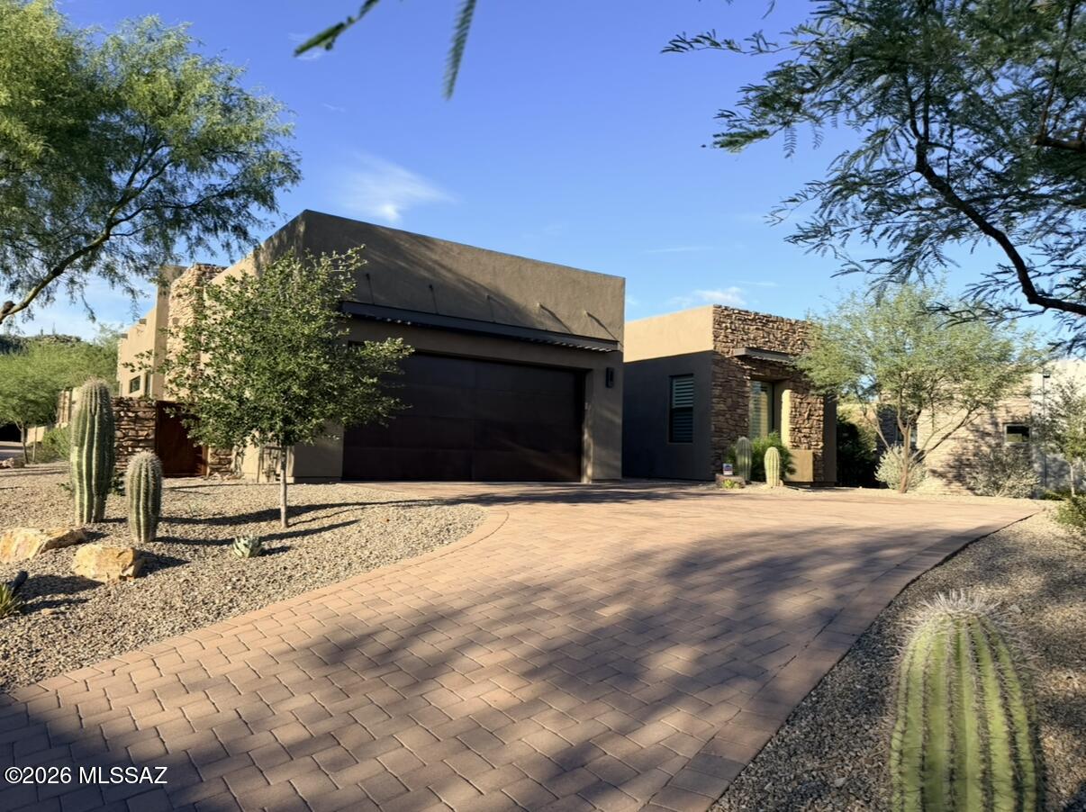 Gorgeous Contemporary Home behind the gates of Stone Canyon in the coveted Enclave neighborhood. This sophisticated home opens up to an impressive great room with soaring 12' ceilings and 10' sliding glass doors creating the indoor/ outdoor living experience.