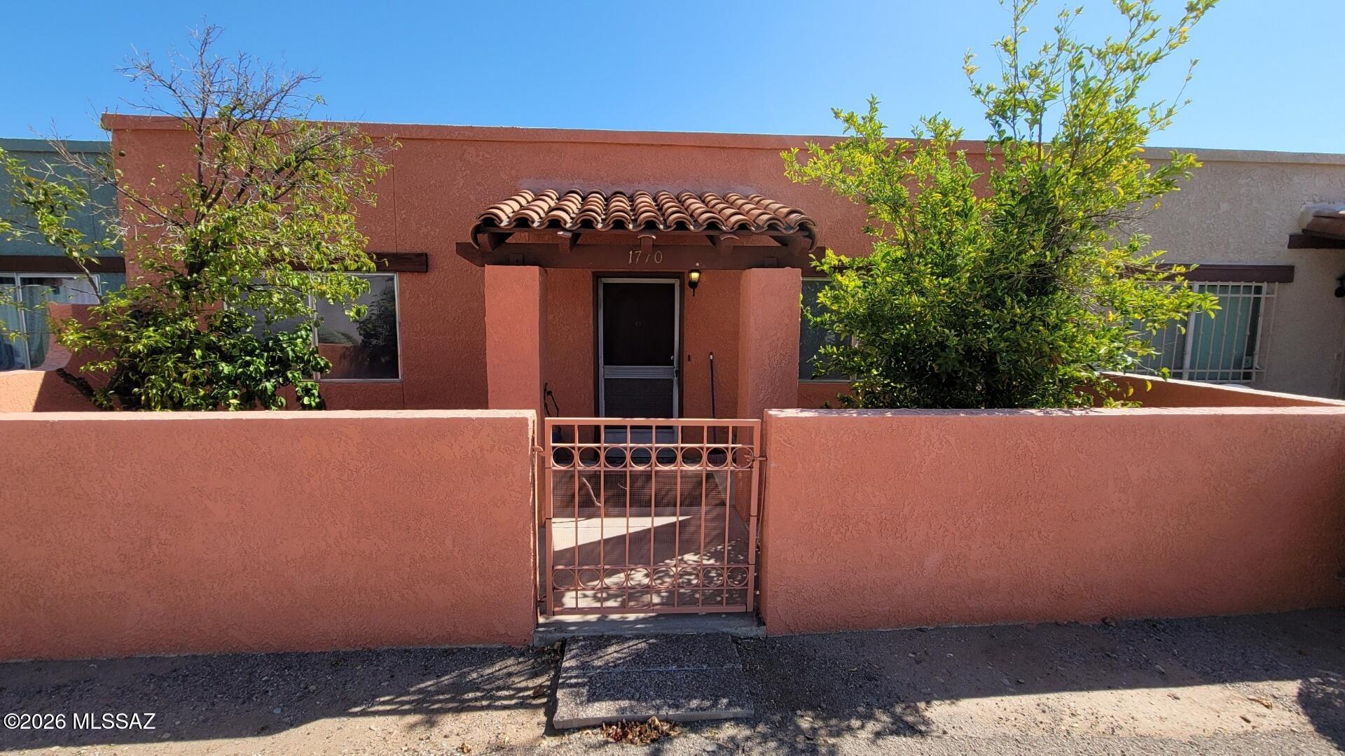 Great townhome in a quiet neighborhood. Saltillo tile, decorator paint touches, skylight and ceiling fans, covered patio and carport. Built in BBQ on pack patio. Front patio faces open area, two beautiful citrus trees. Community pool, HOA pays water.
Electric panel was updated in 2024. Roof coated and new skylight installed in 2025. Priced to allow for personal updates and improvements, this property presents an outstanding opportunity for investors, snowbirds, or buyers looking to customize a home to their own taste.