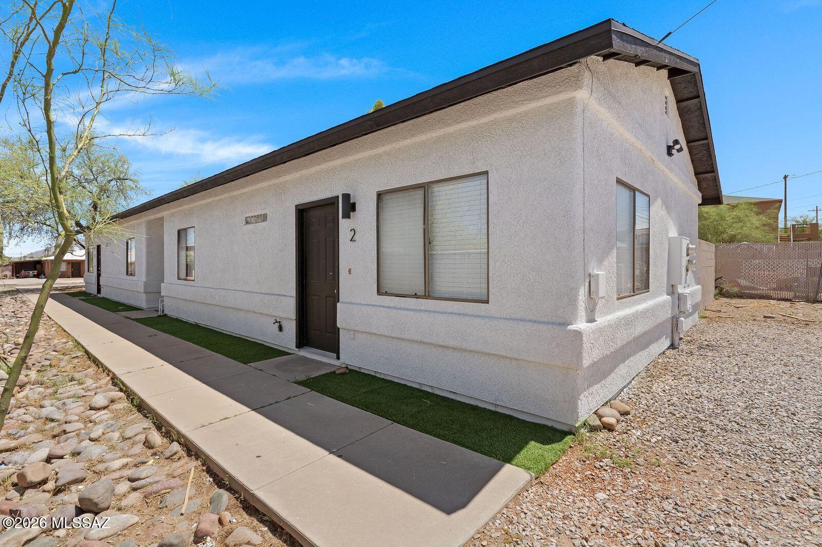 Gorgeously remodeled 2BR/2BA duplex just off Euclid and Lester, bike to UofA in minutes! This spacious home features concrete floors throughout and AC to keep cool all summer. The updated kitchen boasts stainless steel appliances, granite counters, and new cabinets. The guest bath includes a tub, while the master offers a beautifully remodeled shower. Enjoy a large private laundry room with washer and dryer included. The fully walled backyard with turf is perfect for relaxing or entertaining. Pet friendly and close to everything, this one won't last!