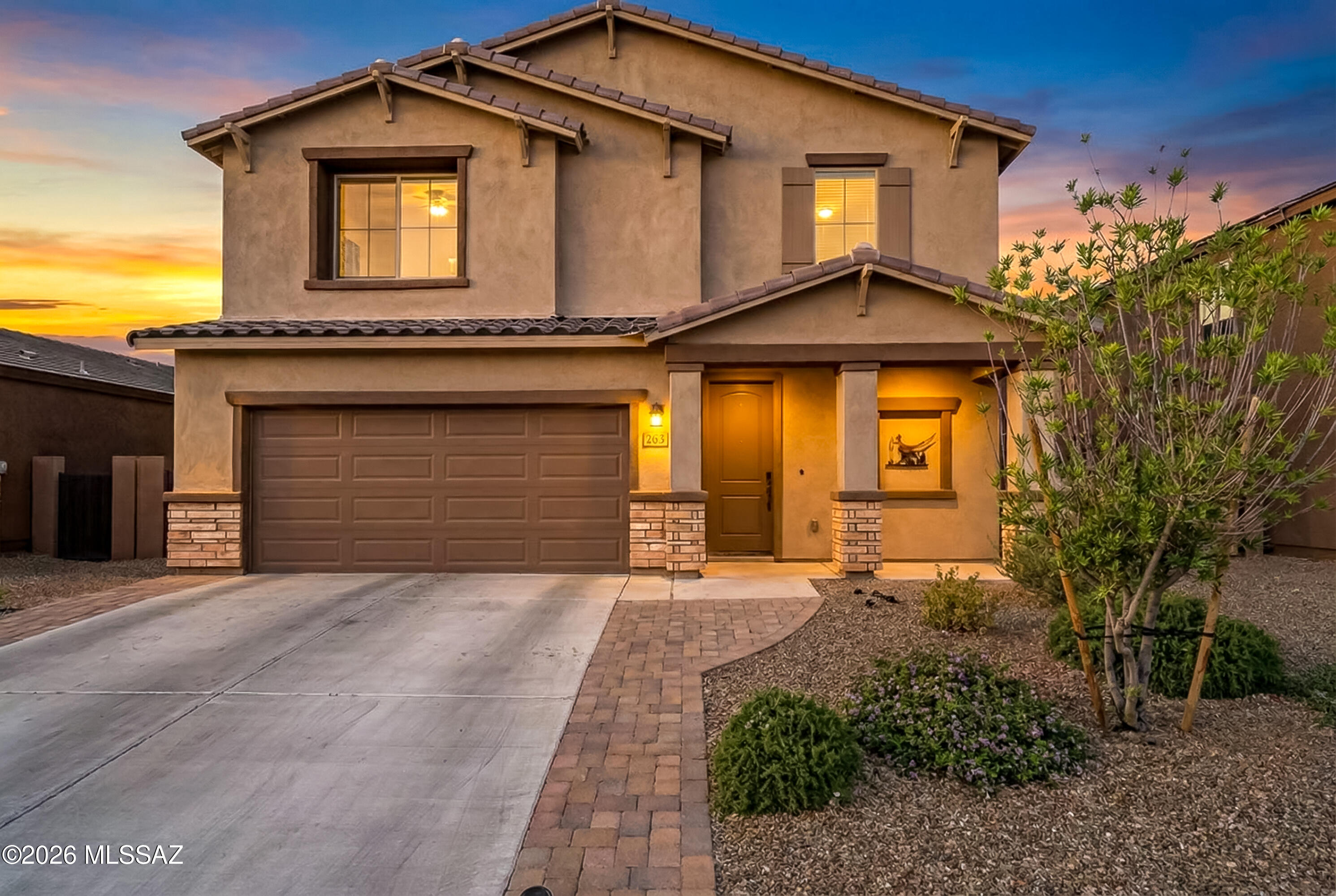 This spacious 5-bedroom home with a 3-car garage delivers the perfect blend of comfort, function, and lifestyle.

The open-concept floor plan designed for modern living, featuring an upgraded kitchen with crisp white cabinetry, granite countertops, and an oversized walk-in pantry that truly sets this home apart. The main level offers a private bedroom with its own full bathroom-ideal for guests, multigenerational living, or a dedicated office space. Upstairs, a versatile loft provides additional room to relax, work, or play, while generously sized bedrooms offer flexibility for any style. The backyard is designed for low-maintenance enjoyment, complete with
pavers and turf-perfect for unwinding without upkeep. Enjoy all amenities Rancho Sahuarita is known for.