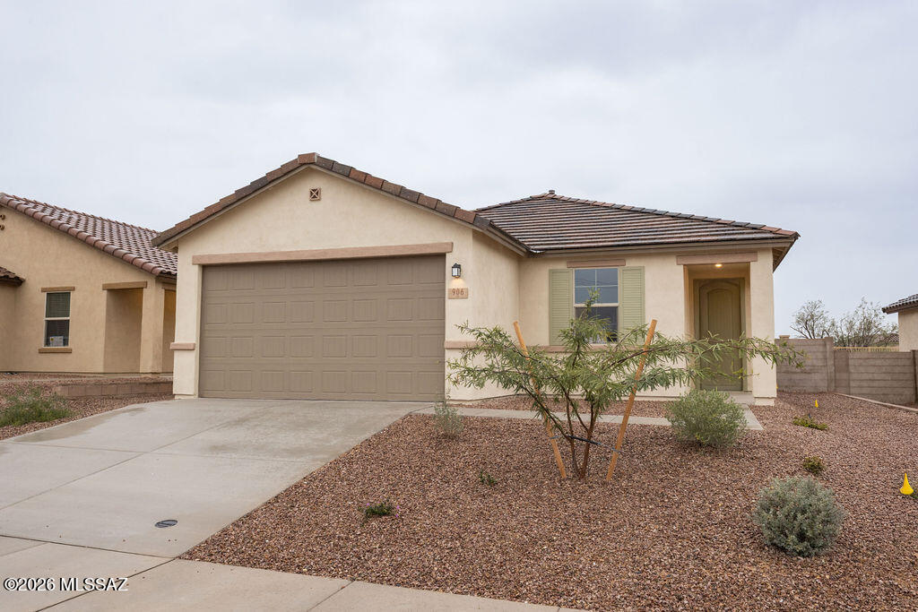 This popular single-story home features 9-ft. ceilings and wood look porcelain tile. The kitchen showcases 42'' cabinets, an island, pantry, and Whirlpool® appliances. Relax in the primary suite, which boasts a walk-in closet and connected bath with a dual sink vanity and walk-in shower. The covered back patio provides space for unwinding and entertaining. Ask about our special interest rate promotion. Price includes discount predicated on using seller's preferred lender KBHS.