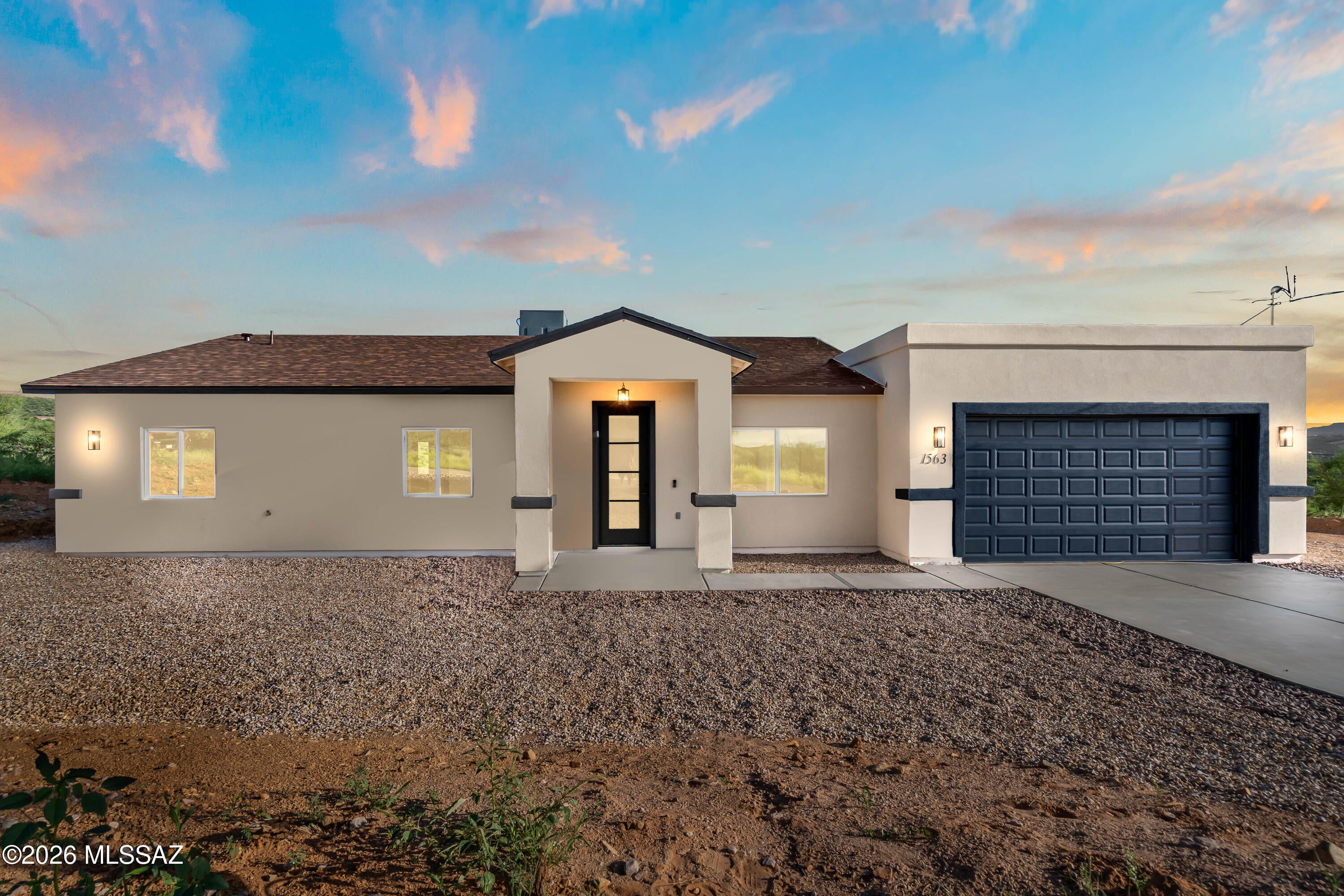 Perched on a scenic hillside, this 3-bedroom, 2-bathroom home offers 1,639 sq ft of modern living with breathtaking mountain and city views. The elevated lot provides privacy while showcasing sweeping vistas from multiple areas of the home. Inside, clean lines and contemporary finishes define the space, including quartz countertops and large-format 24x48 ceramic tile flooring for a sleek, low-maintenance feel. The open layout seamlessly connects the kitchen and living areas, ideal for everyday living and entertaining. With its blend of style, function, and unbeatable views, this hillside property offers a rare opportunity for refined living.