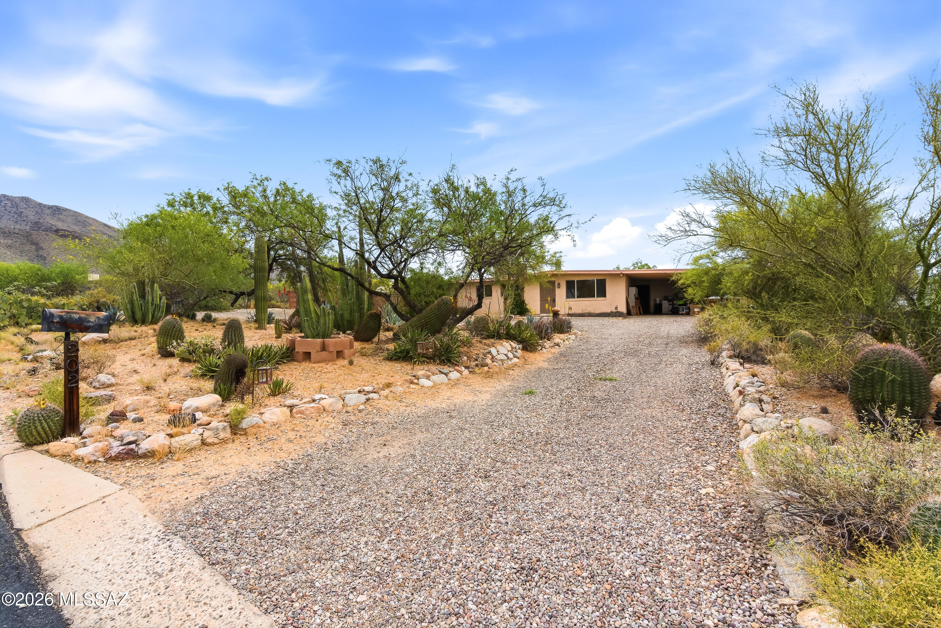 This spacious 4 bedroom, ranch style home tucked away on a peaceful, private .83 acre lot provides the perfect setting for enjoying vibrant sunsets, spectacular mountain views and peaceful desert living! The extra large den provides plenty of room for hobbies, office, library, exercise or extra guest bedroom space! There are two master suites with one having its own HVAC unit. Other features include a large, bright kitchen with lots of cabinets and breakfast bar, workshop, Conex storage box outside. 

Live within minutes of the area's premier hiking and biking trail, while maintaining quick access to restaurants, shopping, hospitals!