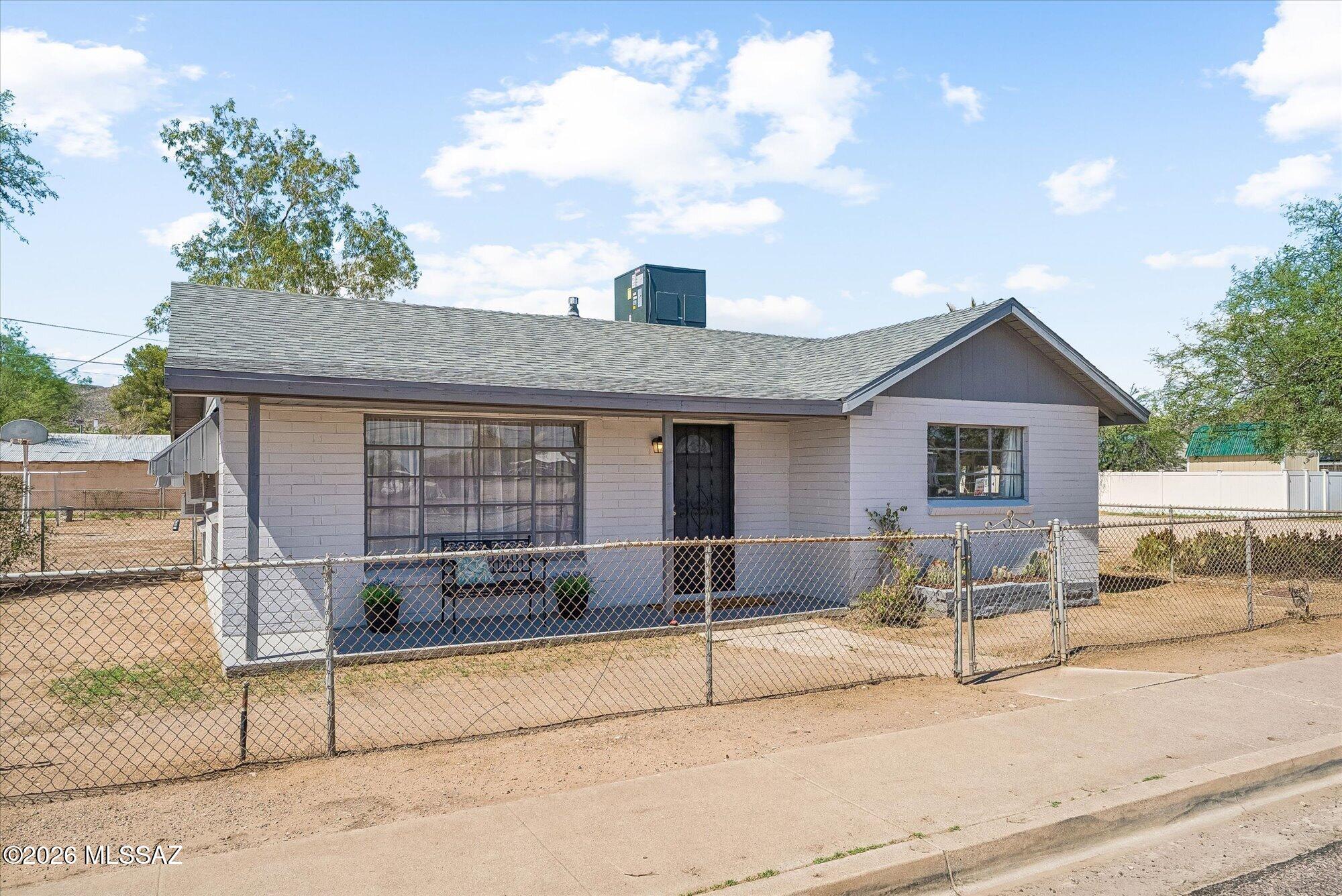 **New HVAC** & Welcome to this charming and well-maintained property offering comfort, versatility, and small-town Arizona living. This 3-bedroom, 2-bath home features a spacious and inviting floor plan with a generously sized primary suite, providing the perfect retreat. The home has been recently remodeled inside and showcases new flooring throughout, creating a fresh, modern feel. Major updates provide peace of mind, including a new roof on both the main house and guest apartment (September 2025), new exterior paint on both buildings (September 2025), and a new HVAC system installed in June 2026, along with updated ceiling fans for enhanced comfort and energy efficiency. The bright living spaces flow seamlessly, creating an ideal setting for everyday living and entertaining. Outside, you'll find a large backyard with plenty of room for gardening, pets, play, or outdoor gatherings. A separate guest house offers exceptional flexibility for extended family, visitors, a home office, or potential rental income.
Conveniently located in Winkelman with easy access to local amenities and outdoor recreation, this move-in-ready property combines thoughtful updates, functional living space, and outstanding versatility. Don't miss the opportunity to make this unique property your own!